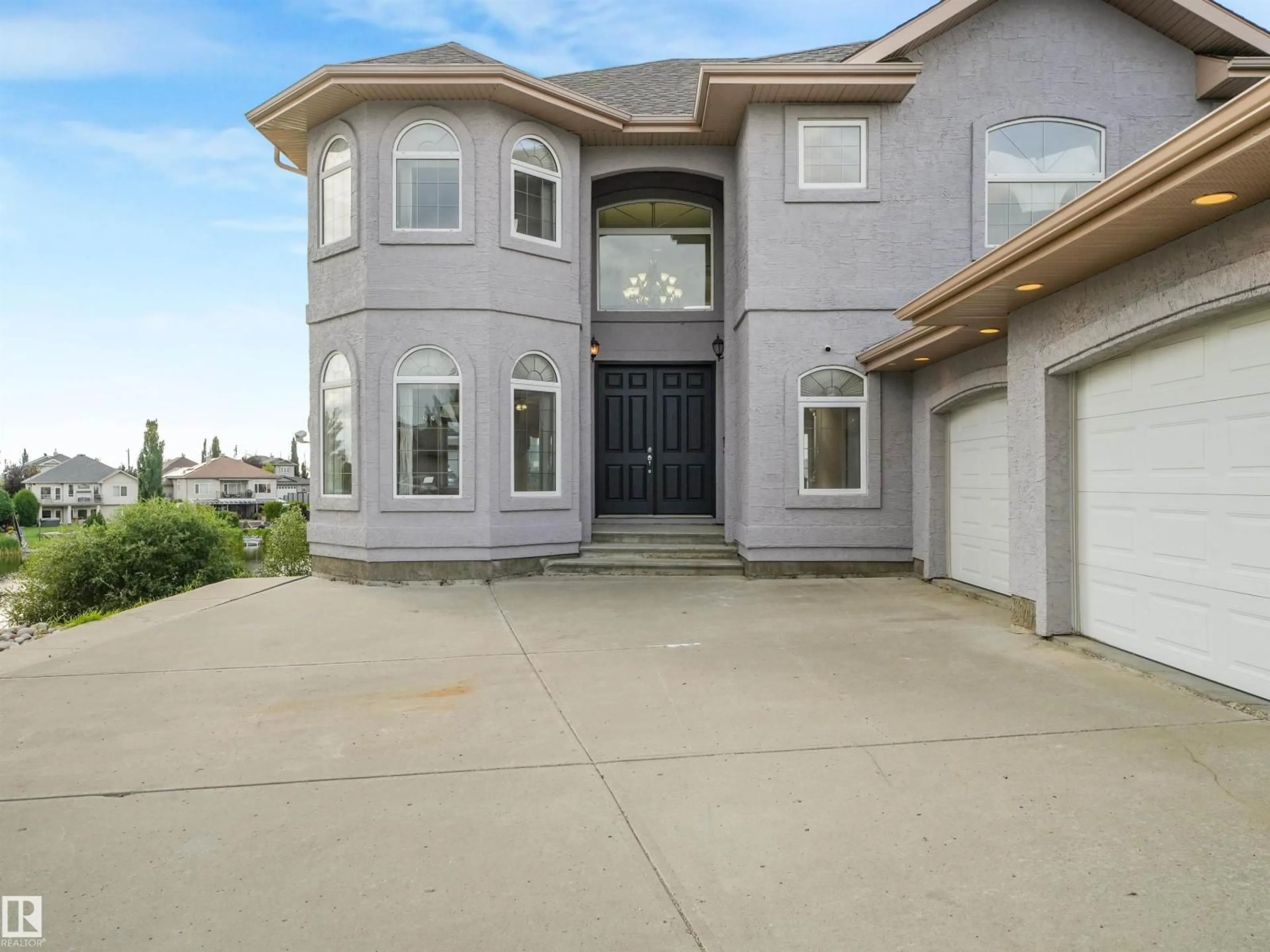 Home with vinyl exterior material, street for 22 SHORES DR, Leduc Alberta T9E8N8
