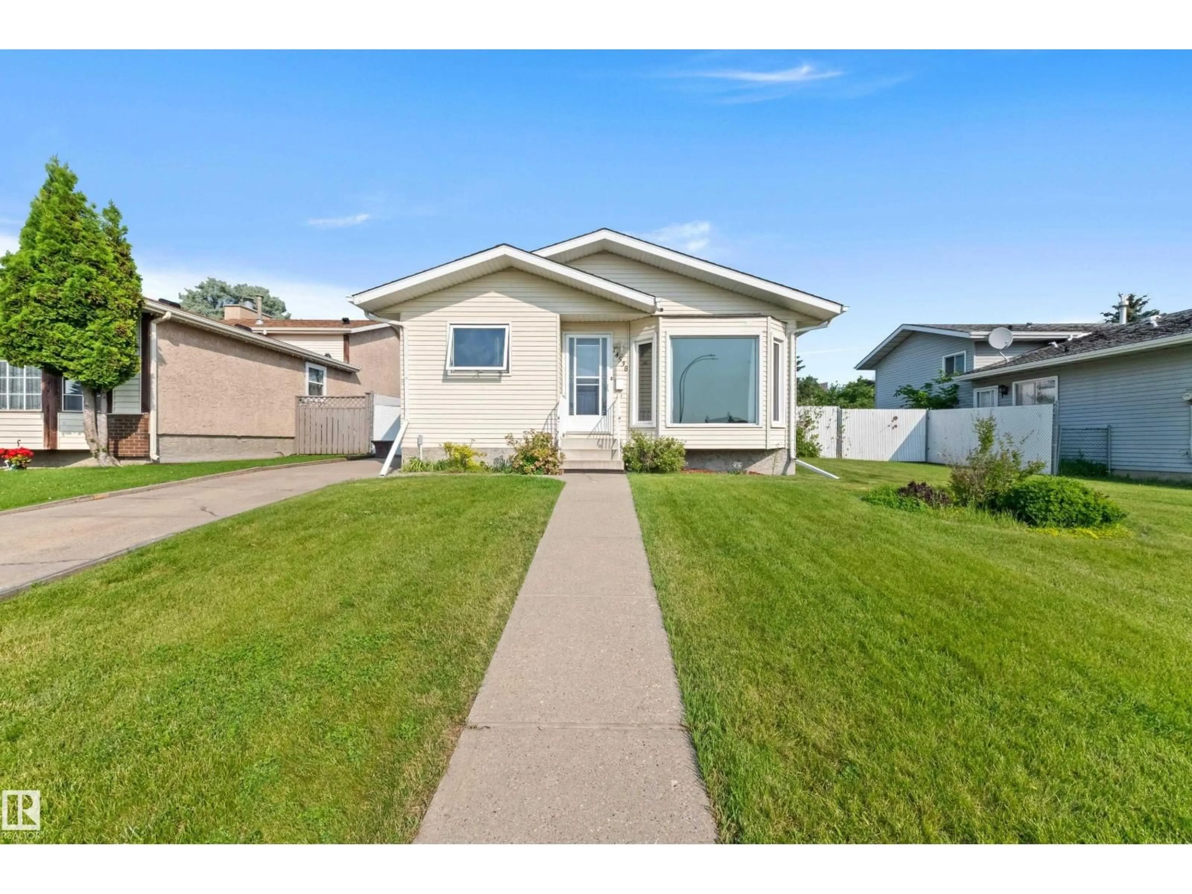 Home with vinyl exterior material, street for 14538 37 ST, Edmonton Alberta T5Y2K2