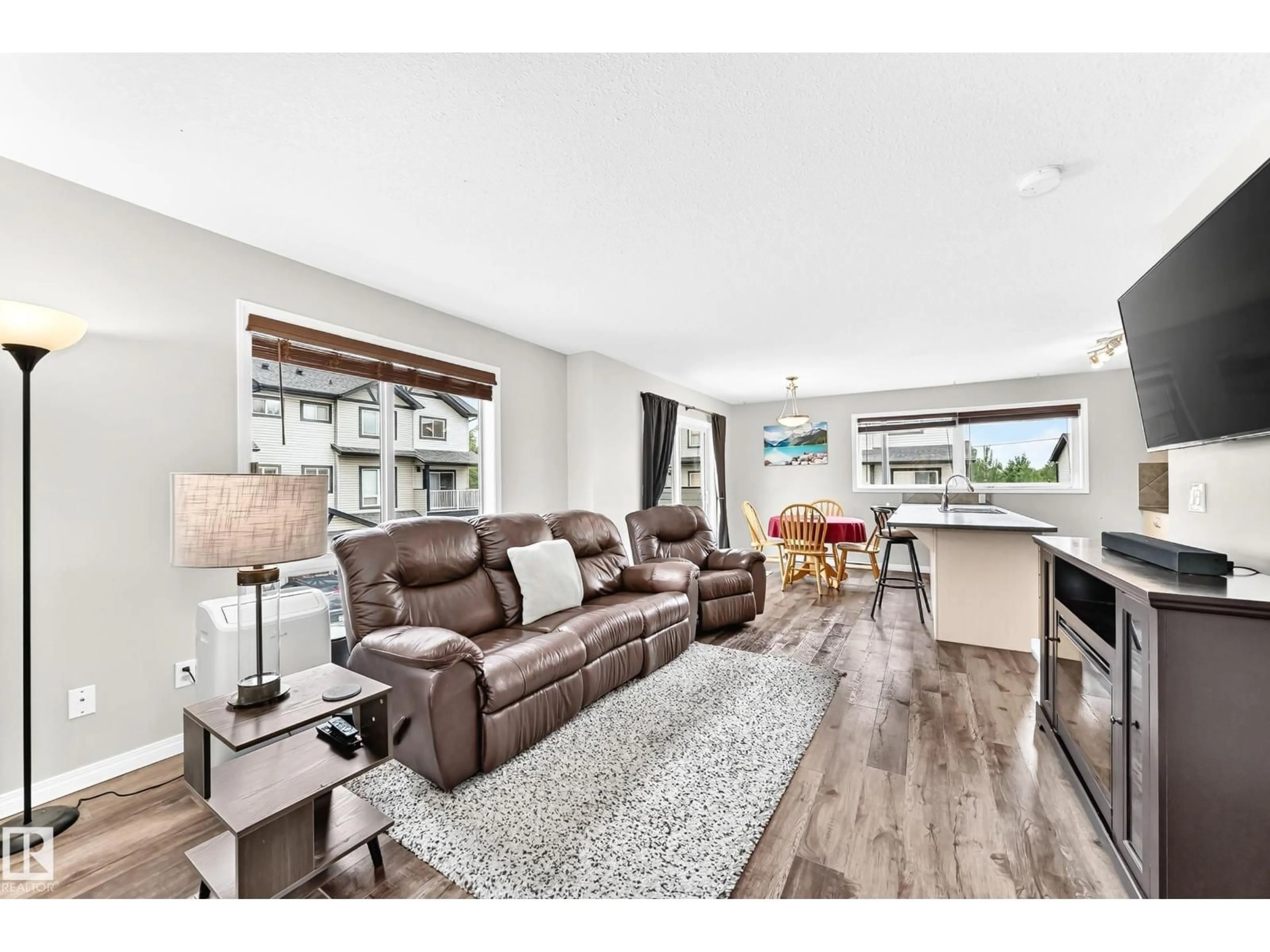 Living room with furniture, wood/laminate floor for 11 - 46 CLOVER BAR LN, Sherwood Park Alberta T8H0C4