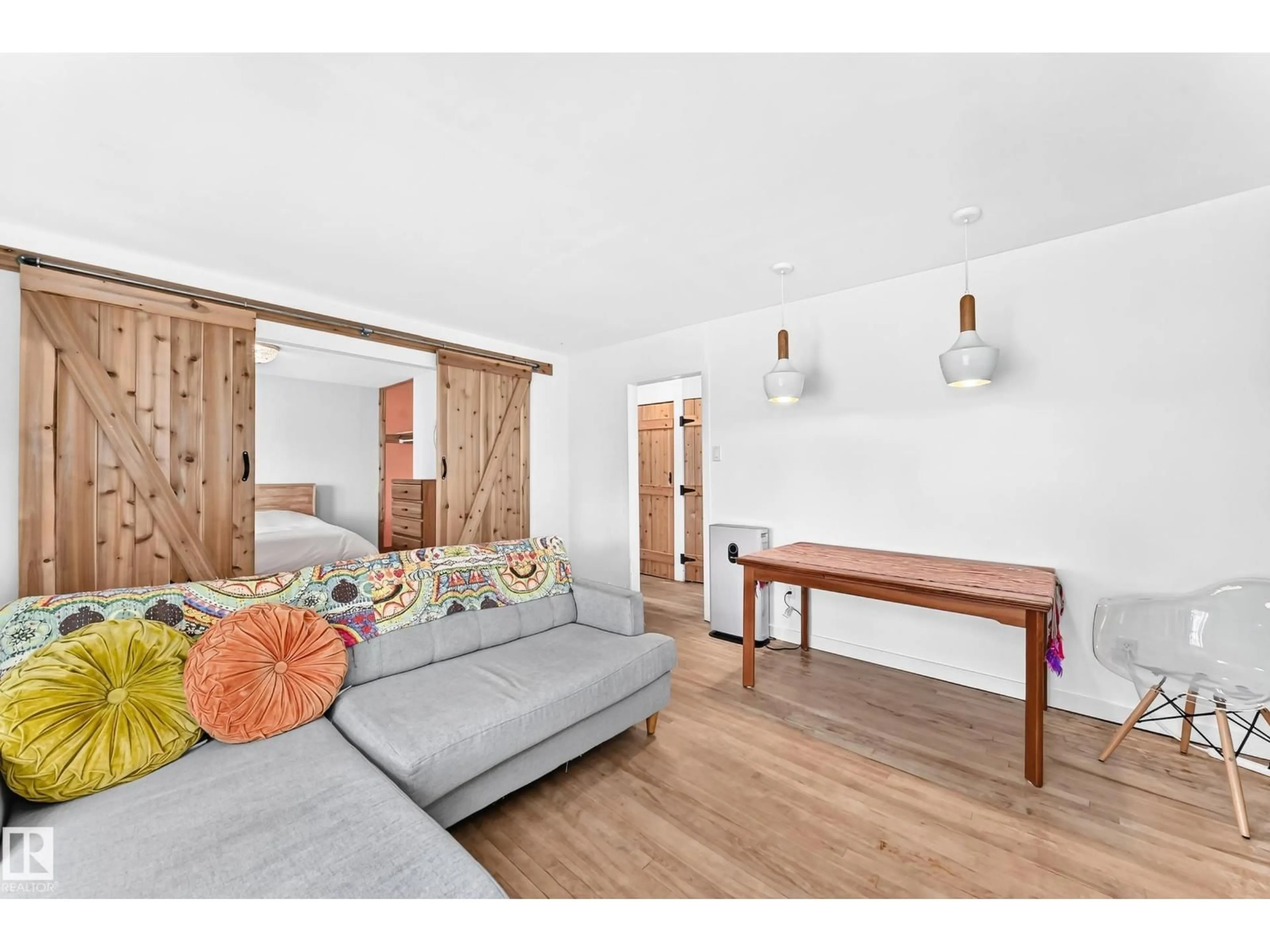 Living room with furniture, wood/laminate floor for NW - 11637 87 ST, Edmonton Alberta T5B3M6