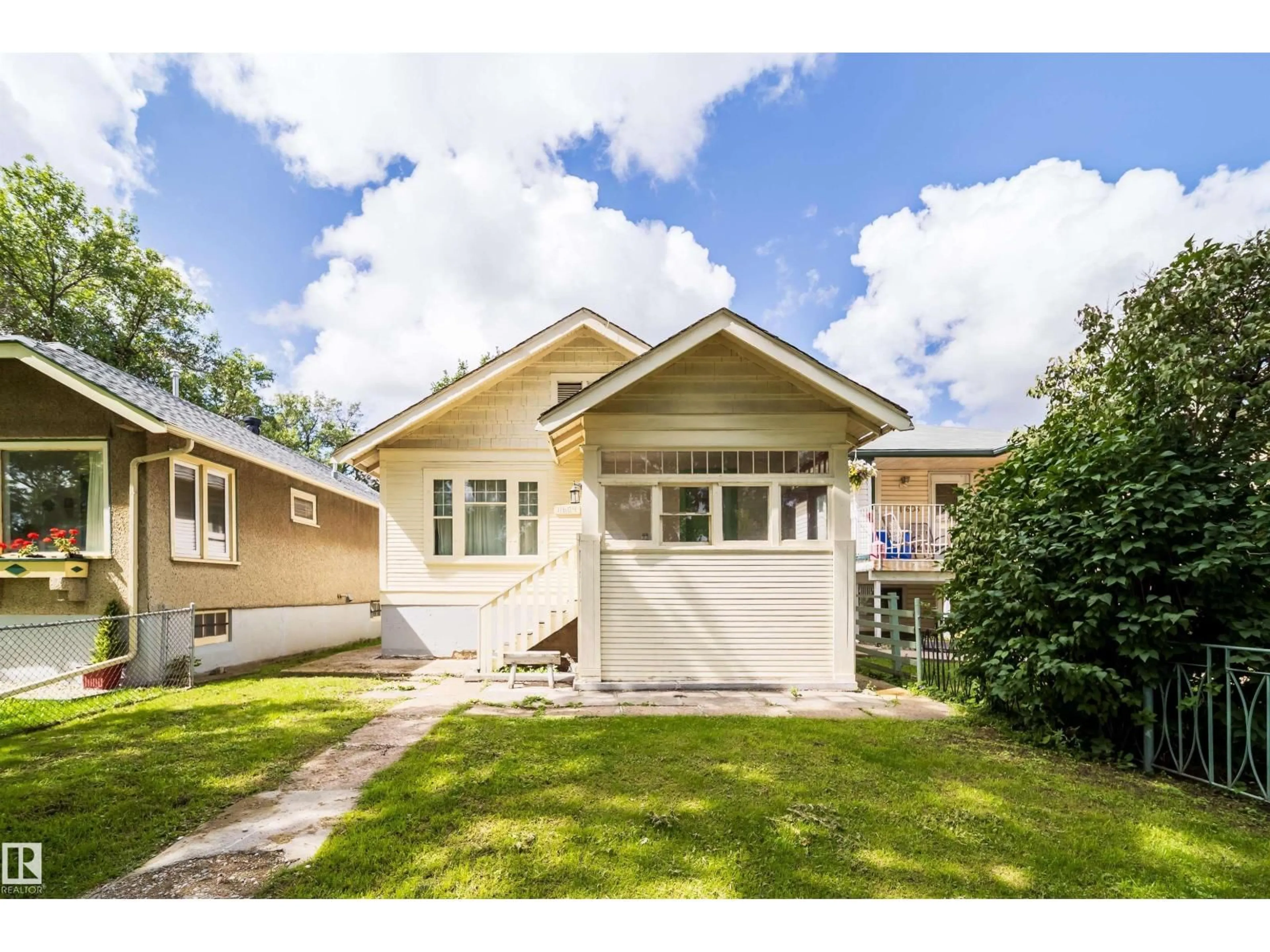 Home with vinyl exterior material, street for NW - 11604 97 ST, Edmonton Alberta T5G1X9