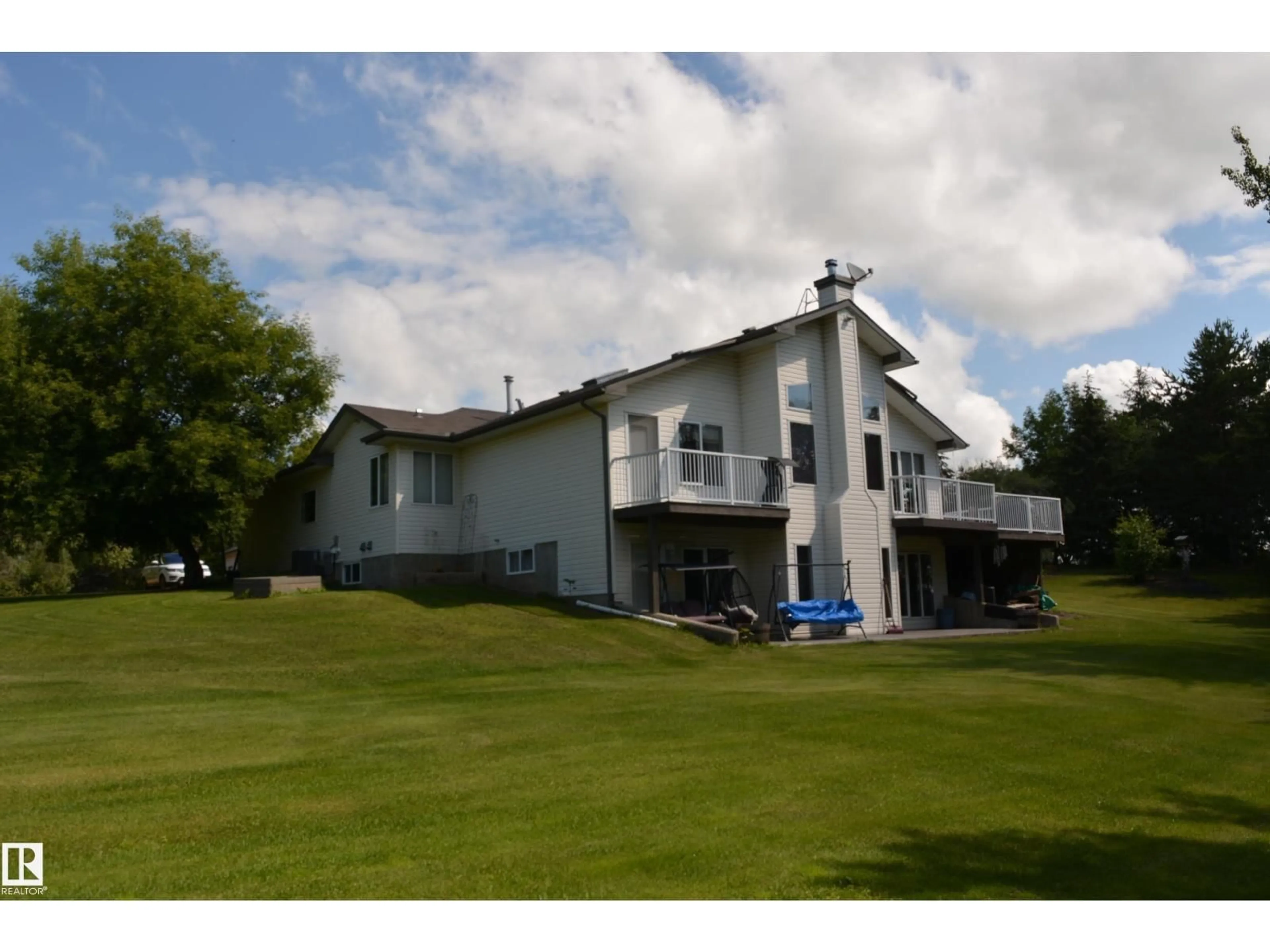 A pic from outside/outdoor area/front of a property/back of a property/a pic from drone, unknown for 1419 HGHWAY 627, Rural Parkland County Alberta T7Y2R1
