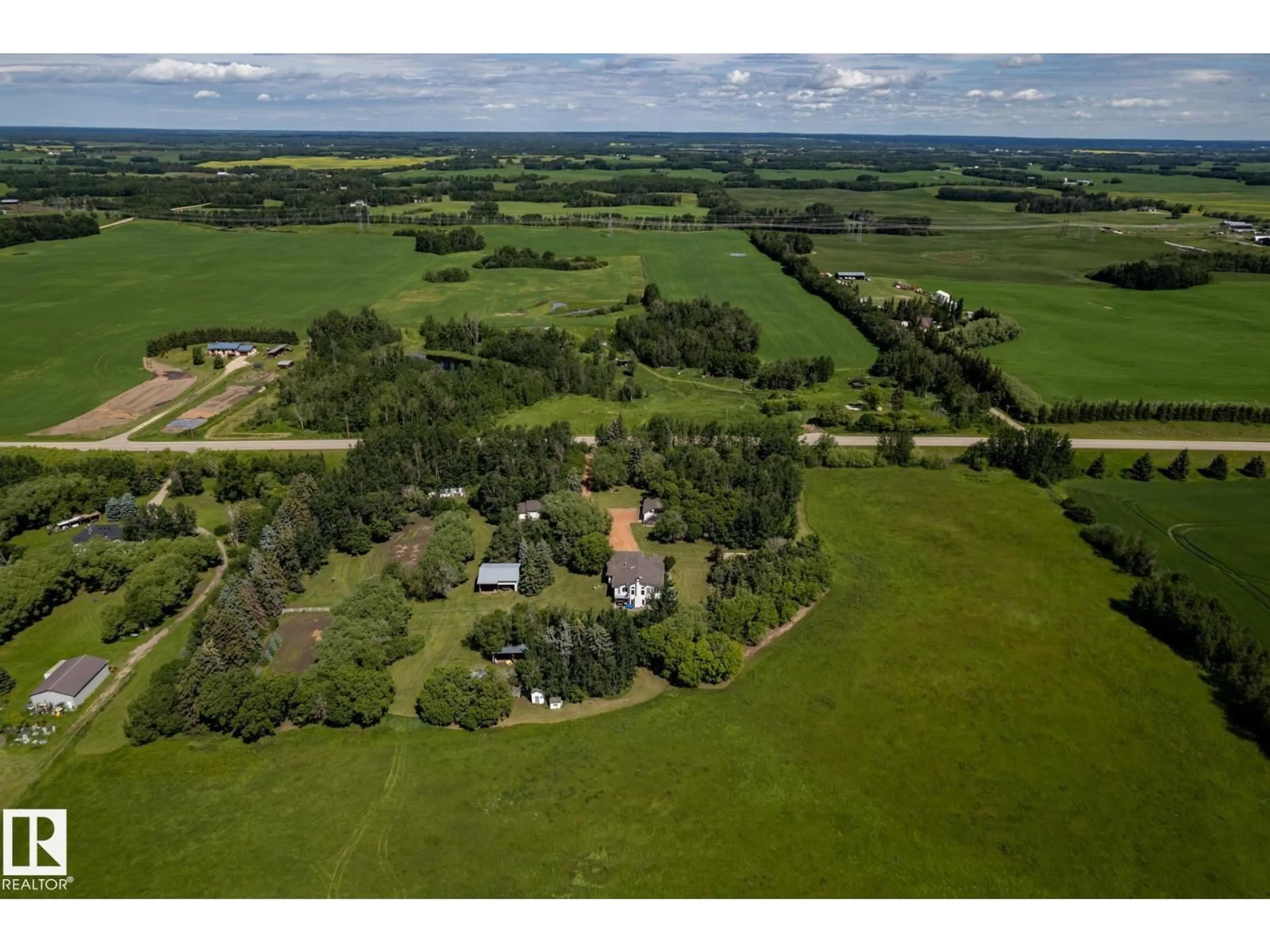 A pic from outside/outdoor area/front of a property/back of a property/a pic from drone, unknown for 1419 HGHWAY 627, Rural Parkland County Alberta T7Y2R1