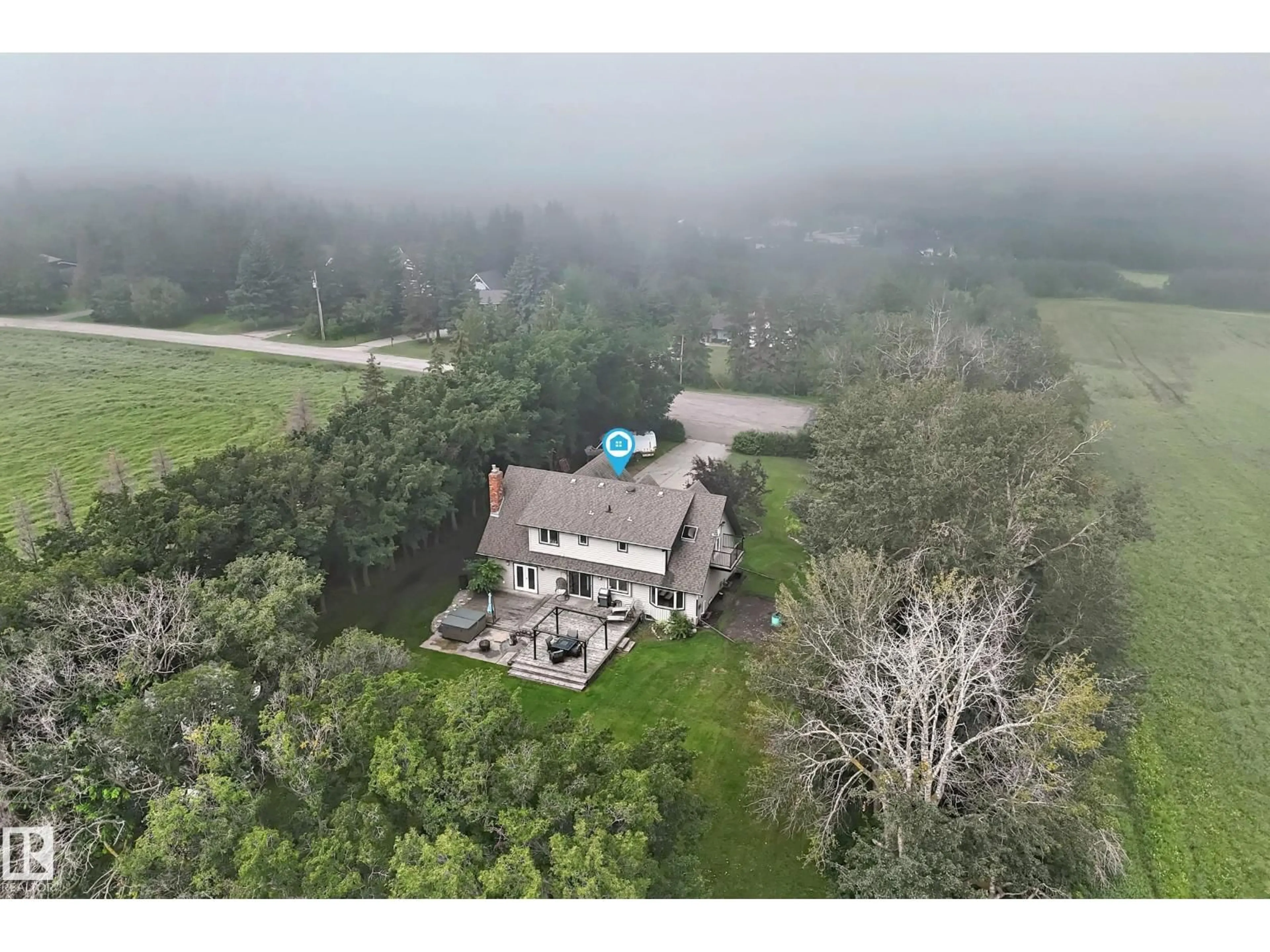 A pic from outside/outdoor area/front of a property/back of a property/a pic from drone, water/lake/river/ocean view for 38 24512 STURGEON RD, Rural Sturgeon County Alberta T8T0B3