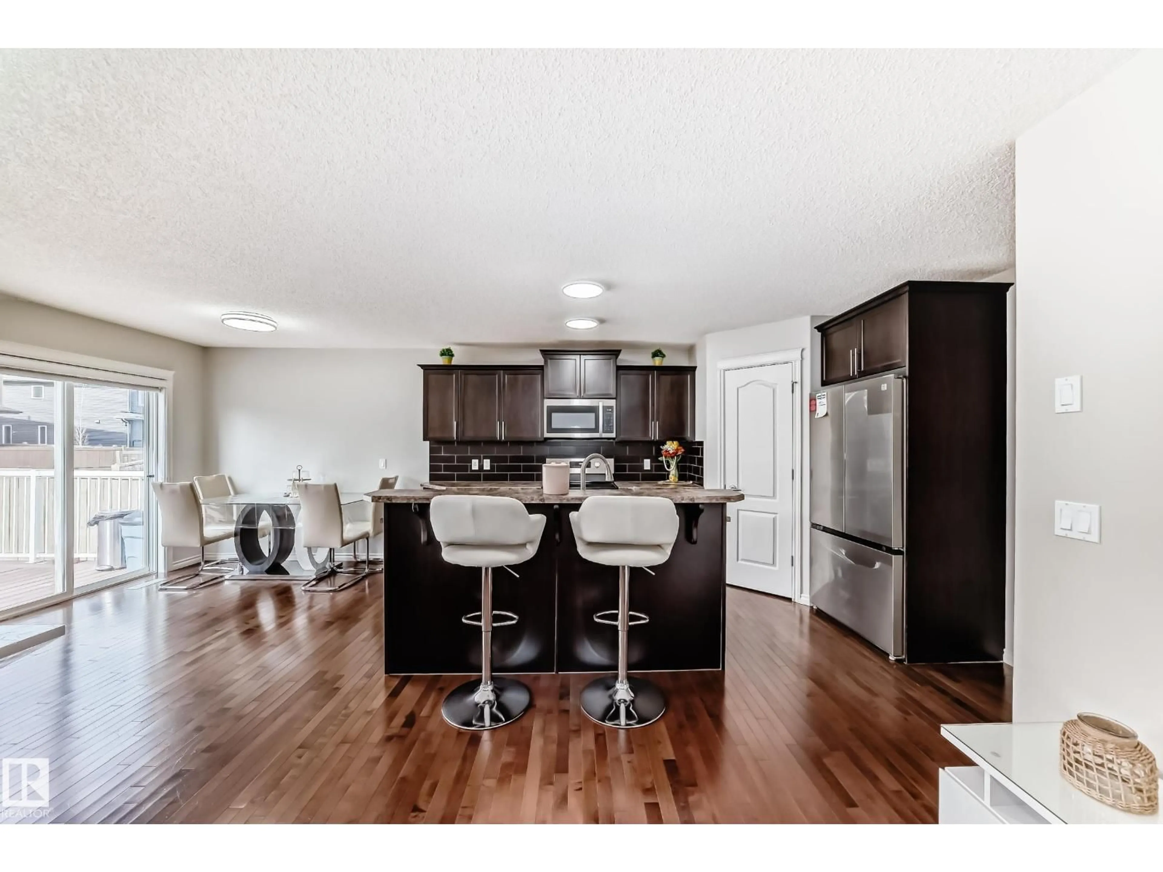 Open concept kitchen, wood/laminate floor for SW - 6419 18 AV, Edmonton Alberta T6X0M9