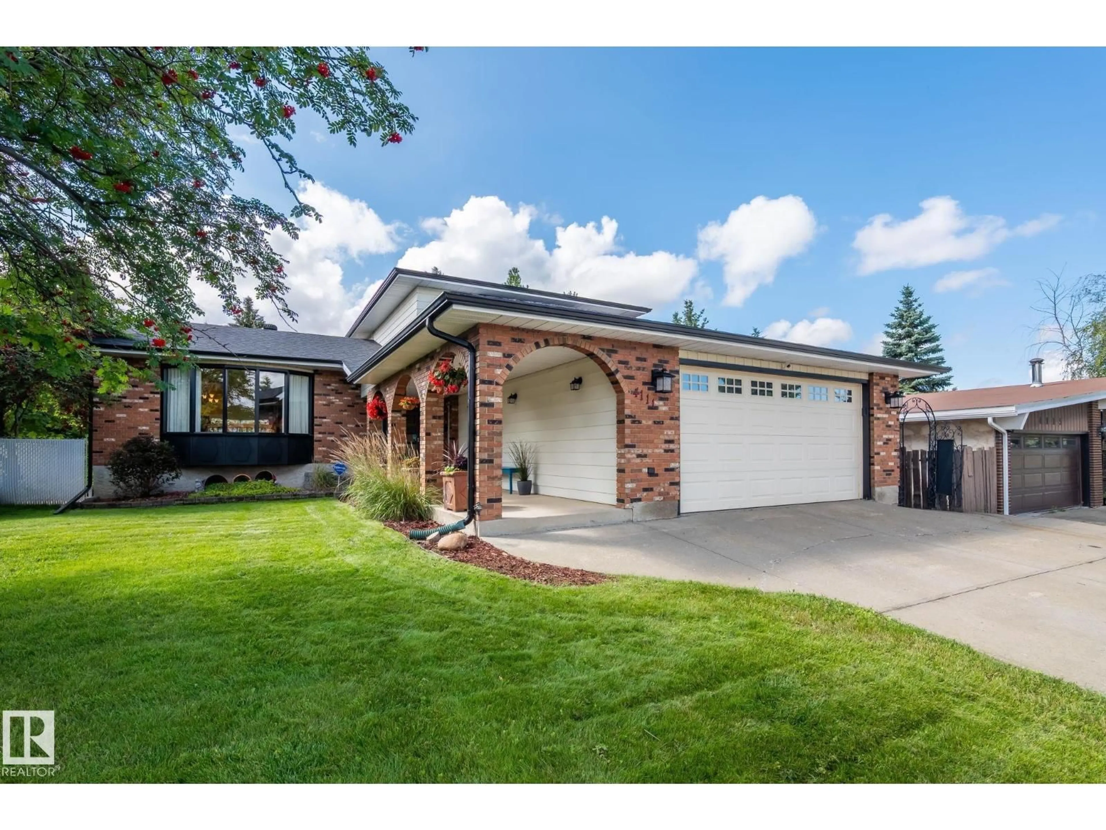 Home with brick exterior material, street for NW - 4111 131 AV, Edmonton Alberta T5A2S6