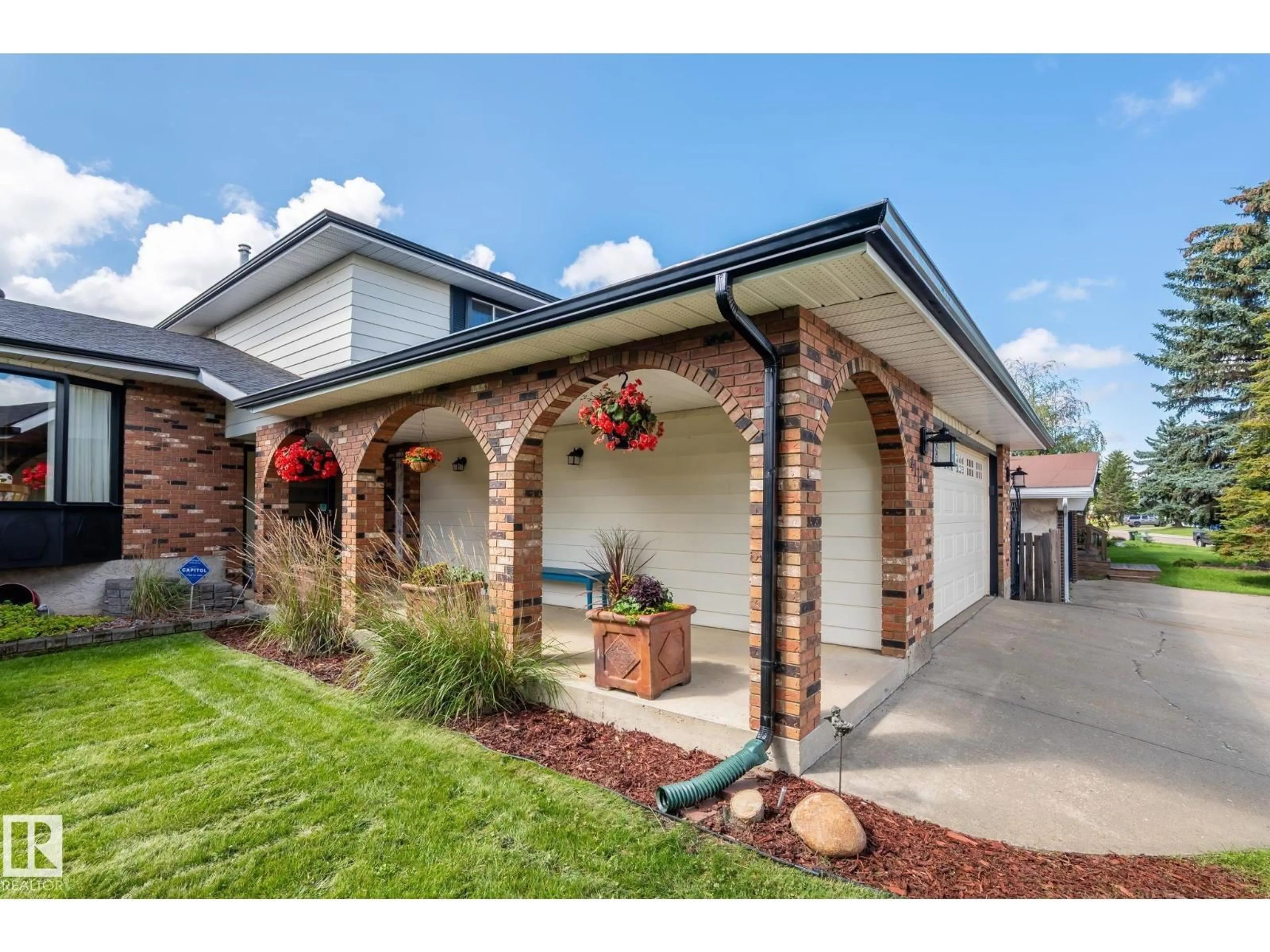 Home with brick exterior material, street for NW - 4111 131 AV, Edmonton Alberta T5A2S6