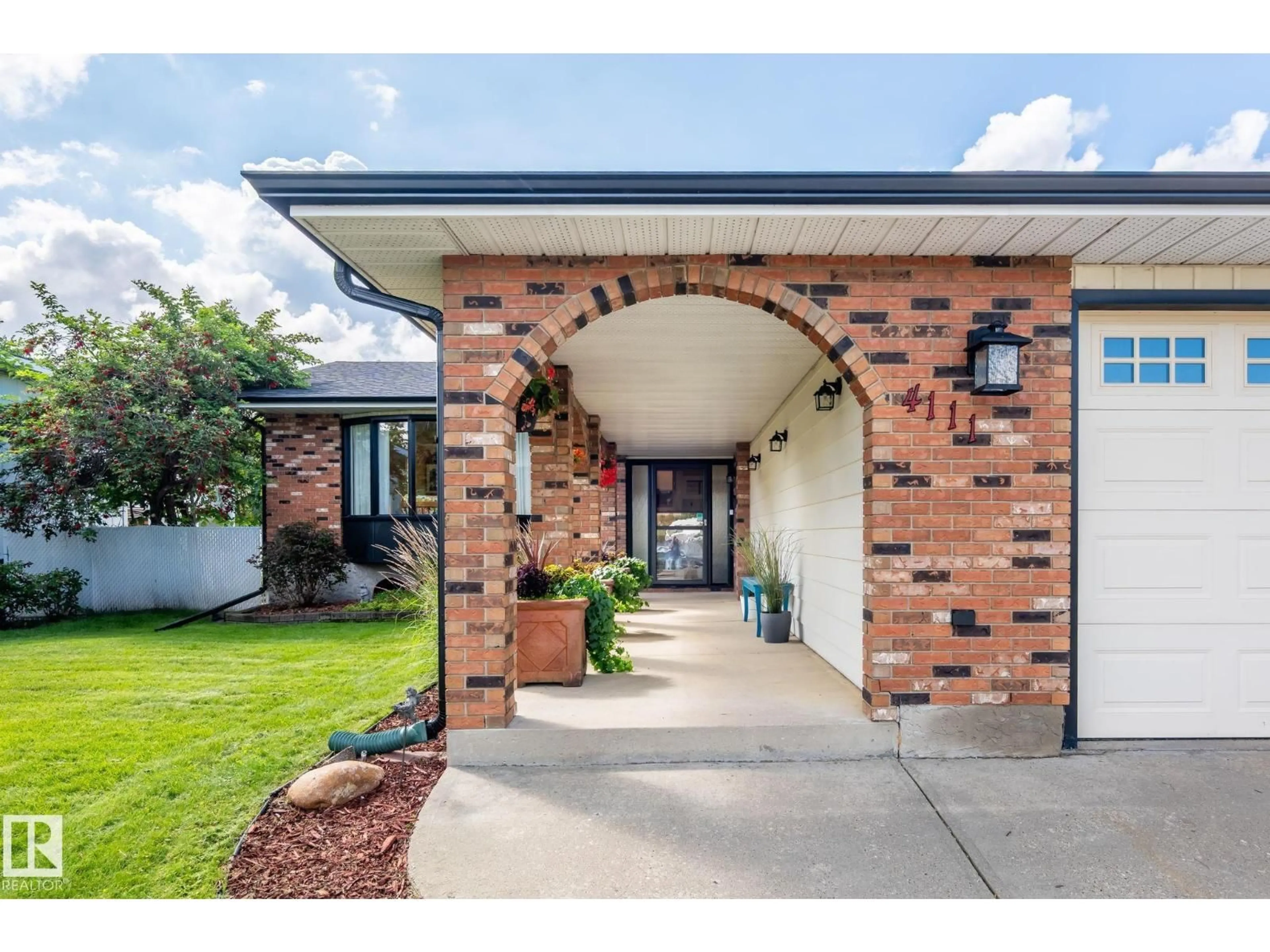 Home with brick exterior material, street for NW - 4111 131 AV, Edmonton Alberta T5A2S6