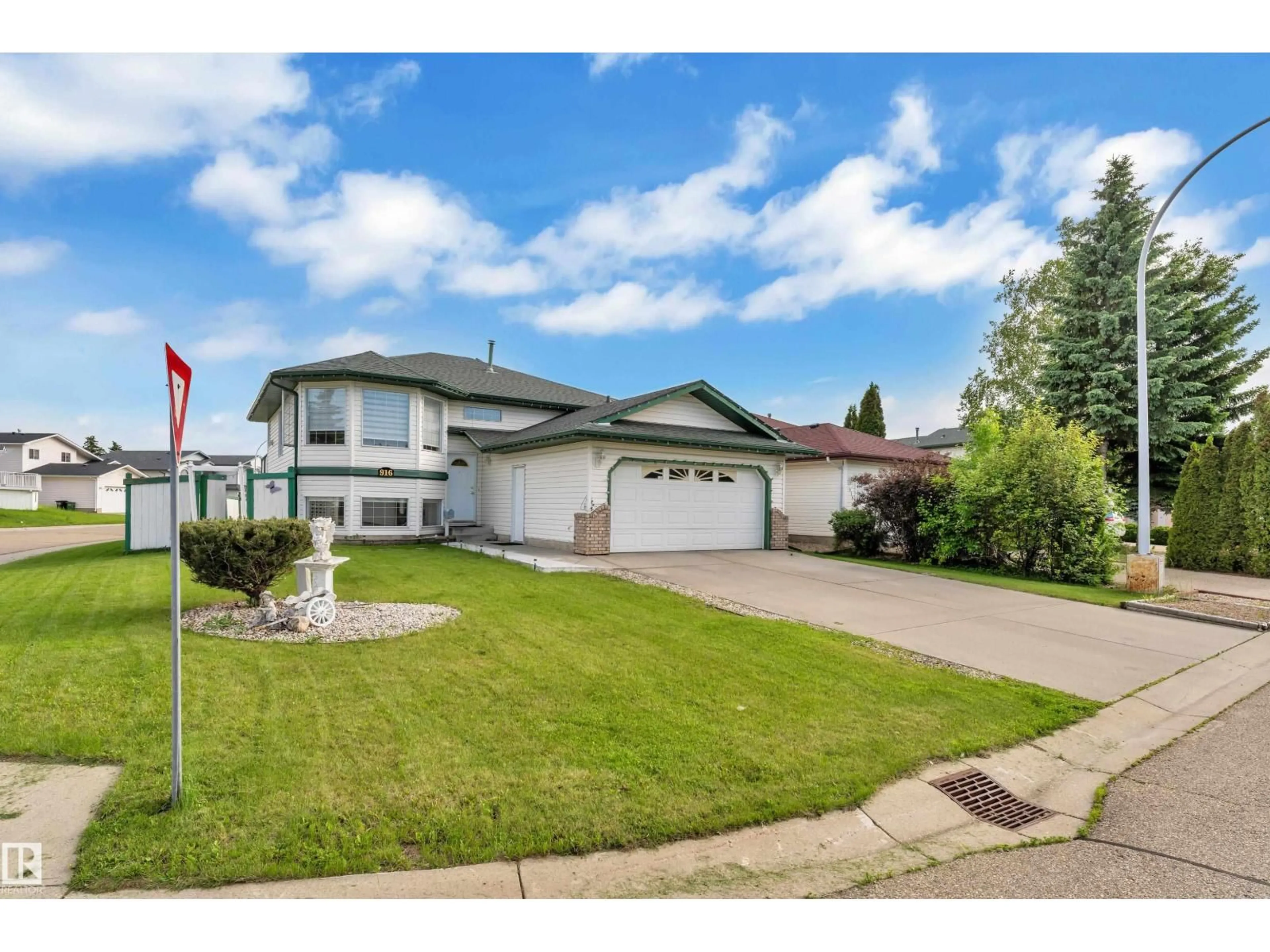 Home with vinyl exterior material, street for 916 JORDAN CR, Edmonton Alberta T6L6X5