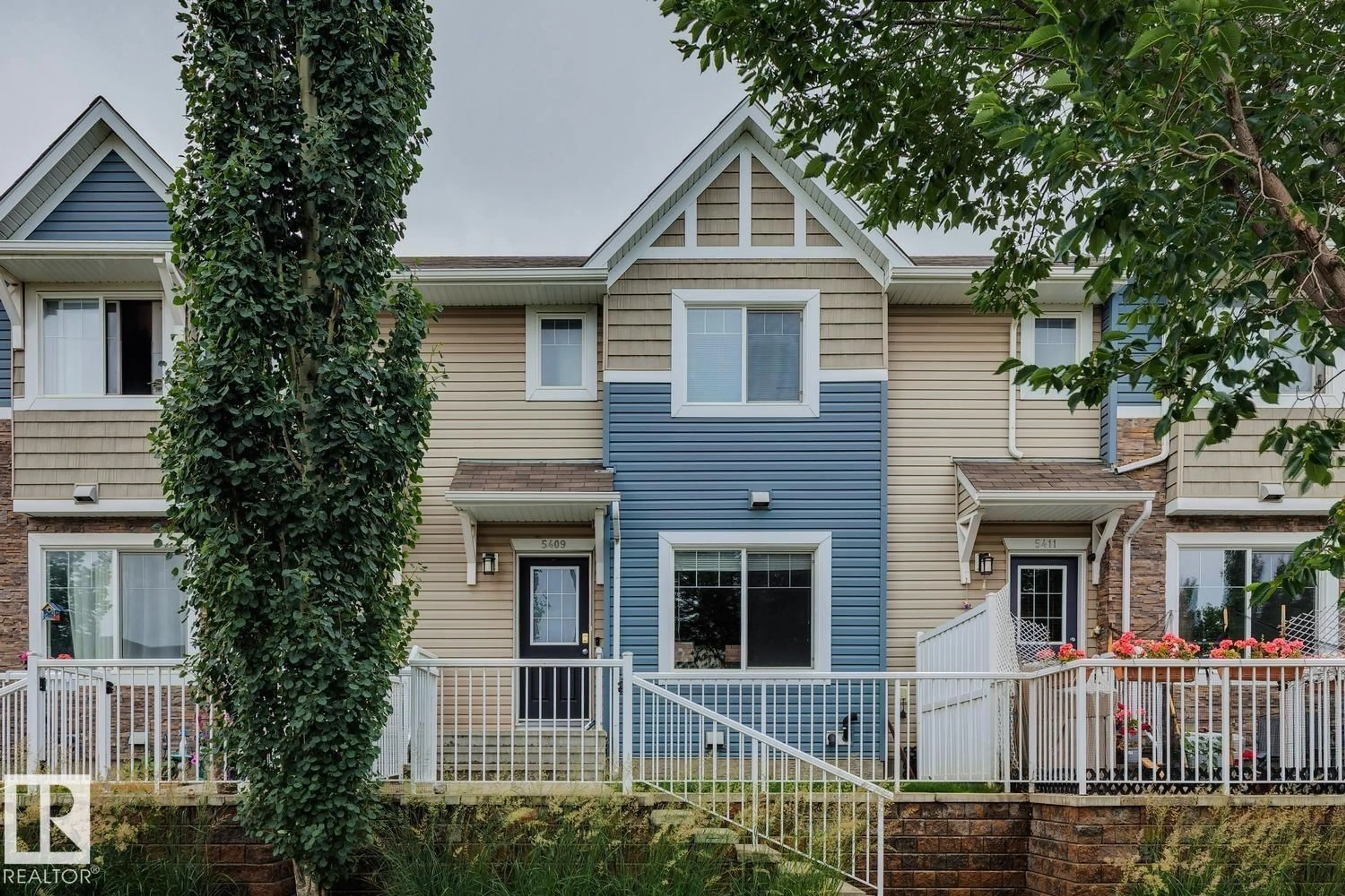 Home with vinyl exterior material, street for 5409 3 AV SW, Edmonton Alberta T6X0W7