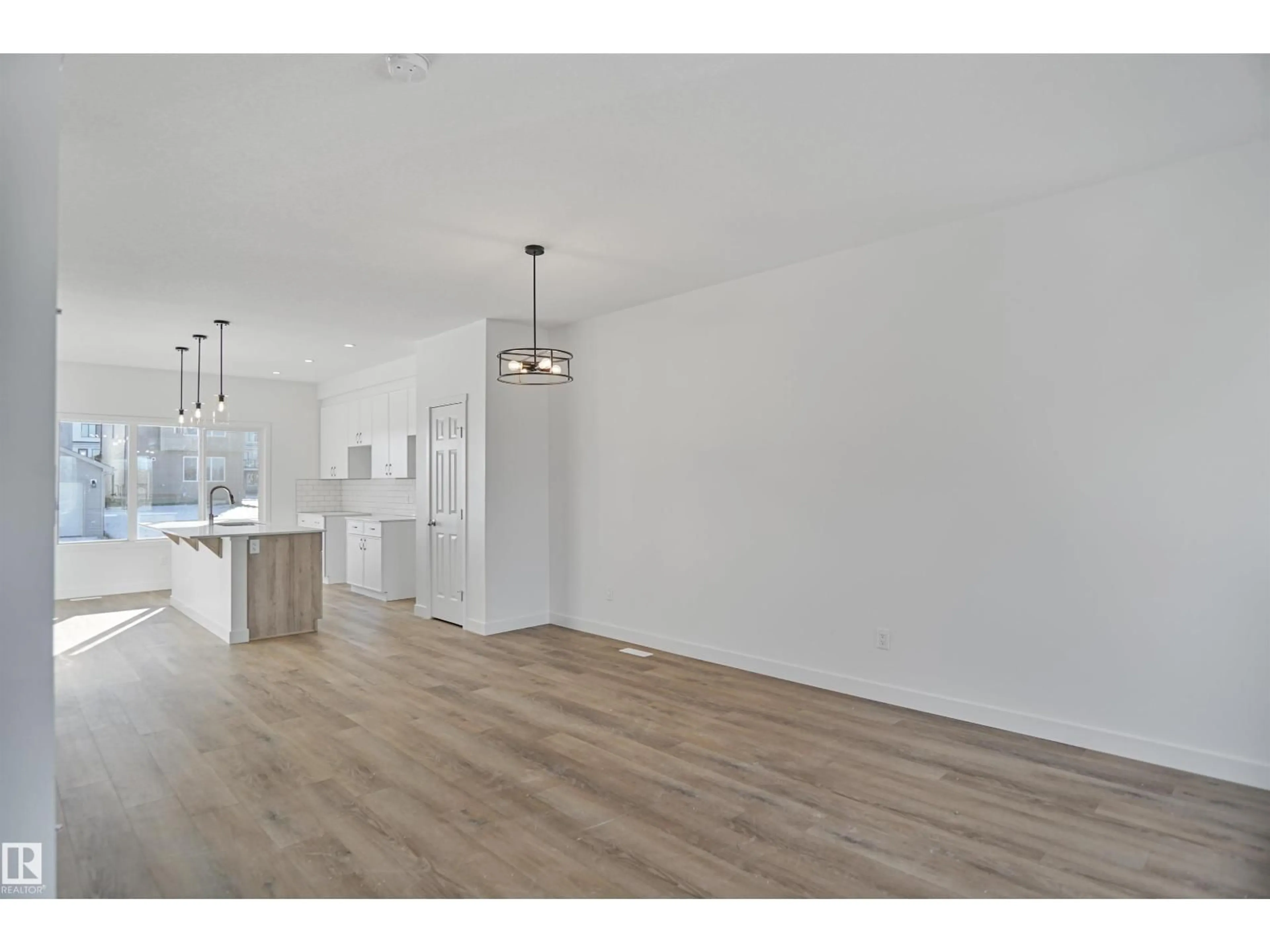 Open concept kitchen, wood/laminate floor for 31 LEAWOOD LI, Spruce Grove Alberta T7X4V1