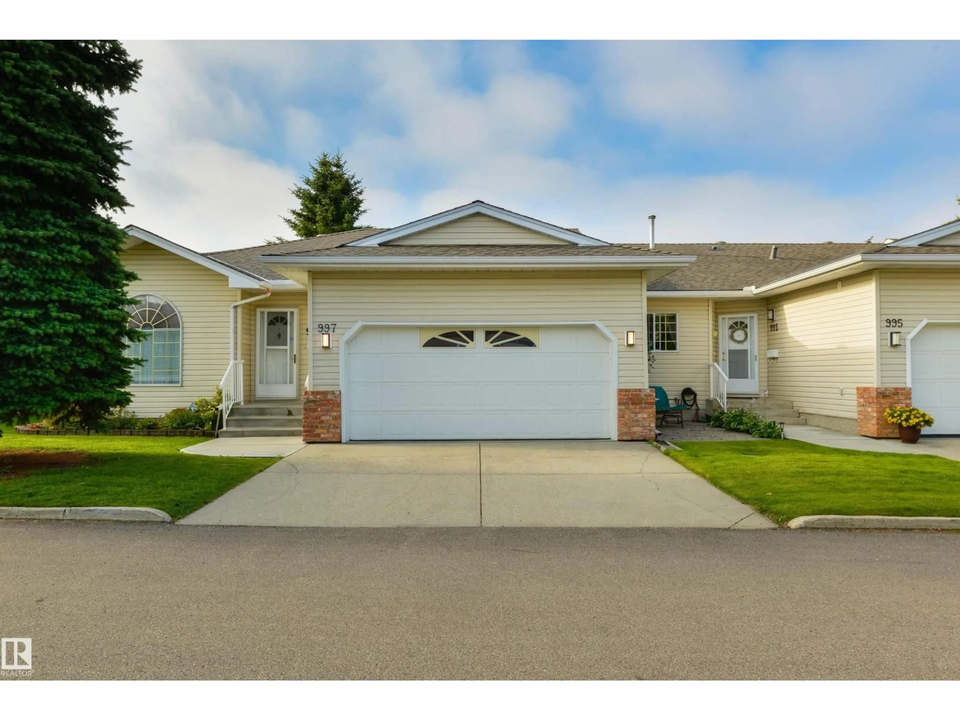 Home with vinyl exterior material, street for 997 YOUVILLE DR W, Edmonton Alberta T6L6T2