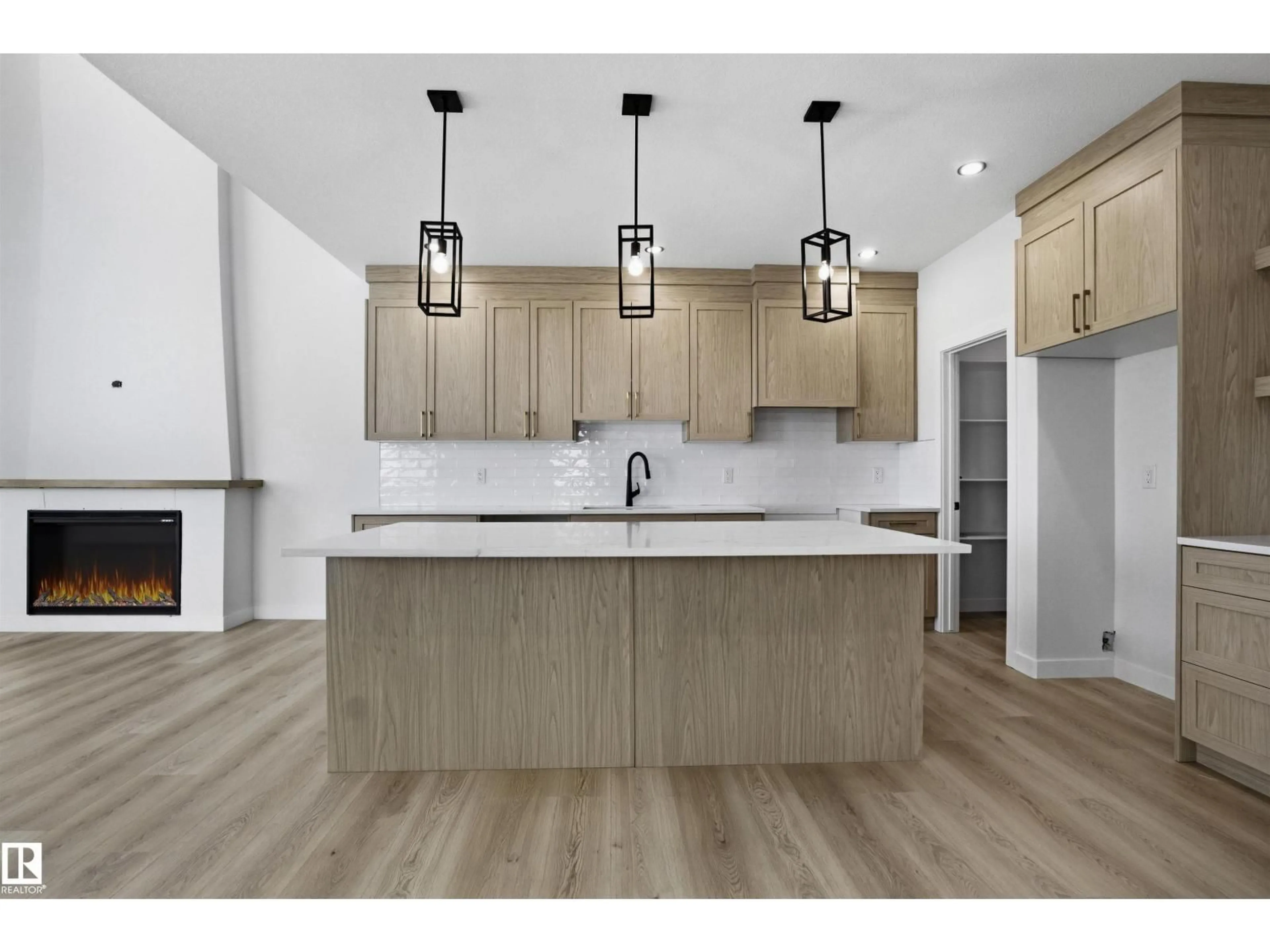 Open concept kitchen, wood/laminate floor for 3304 CHICKADEE DR, Edmonton Alberta T5S0V5