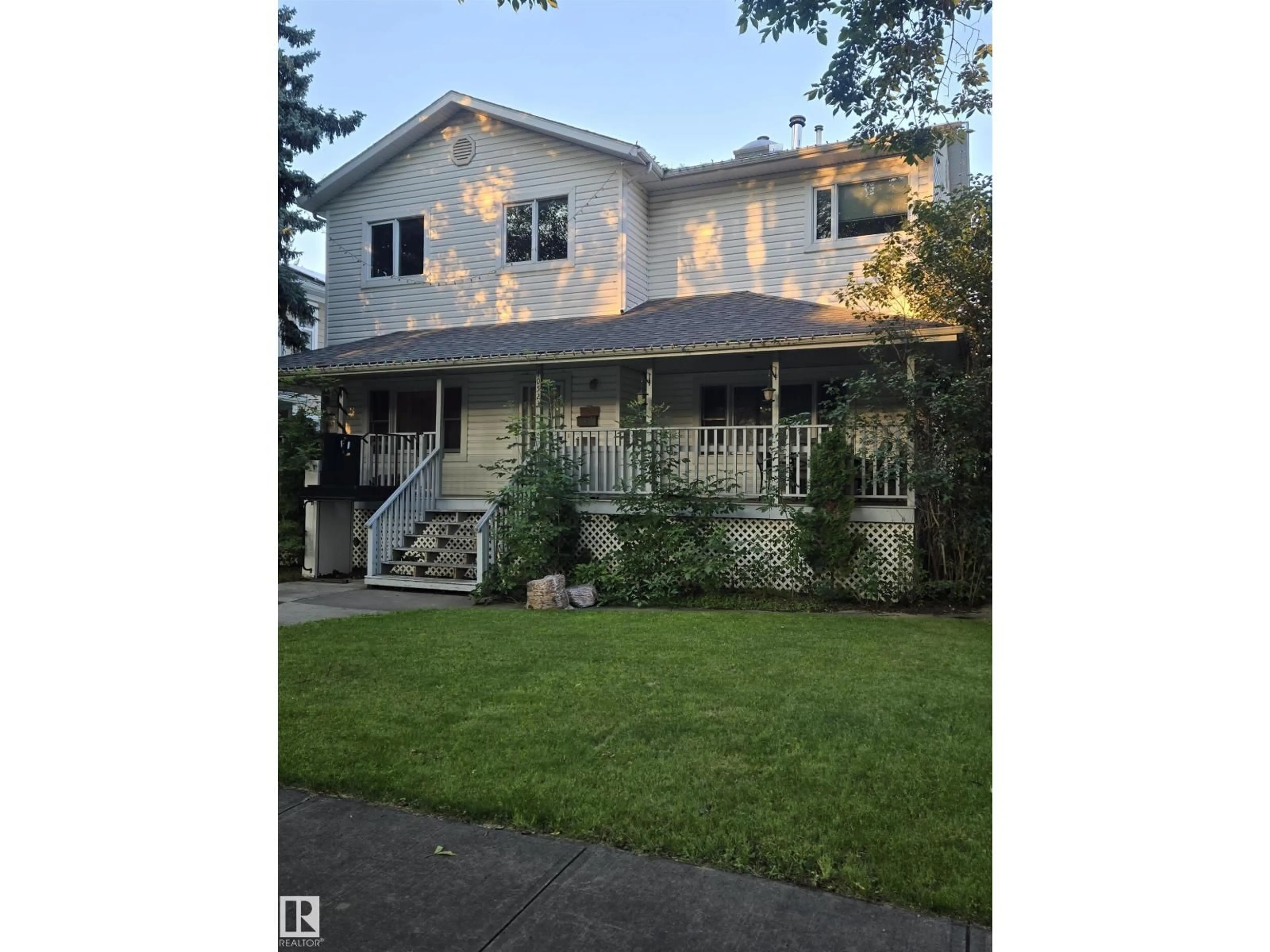 Home with vinyl exterior material, street for 10523 135 ST, Edmonton Alberta T5N2C8