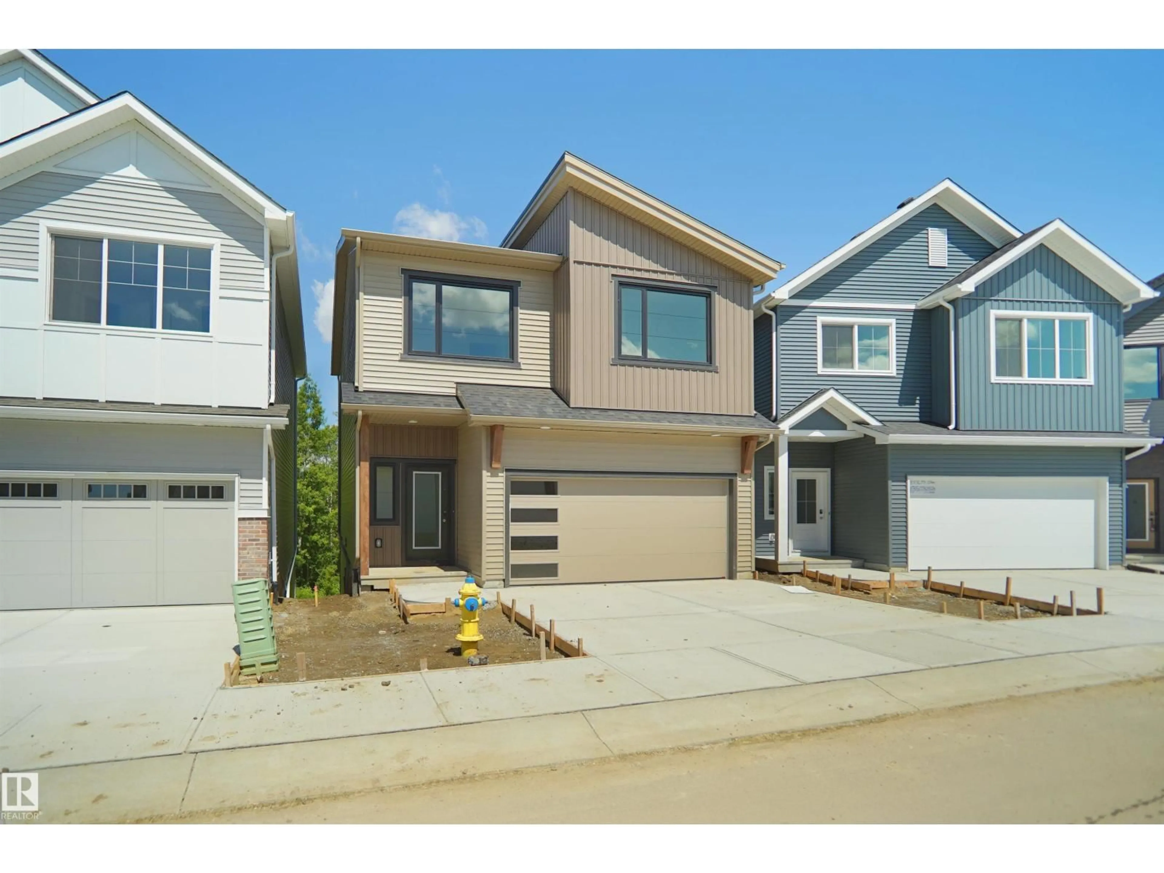Home with vinyl exterior material, street for #33 - 19904 31 AV NW, Edmonton Alberta T6M1N7