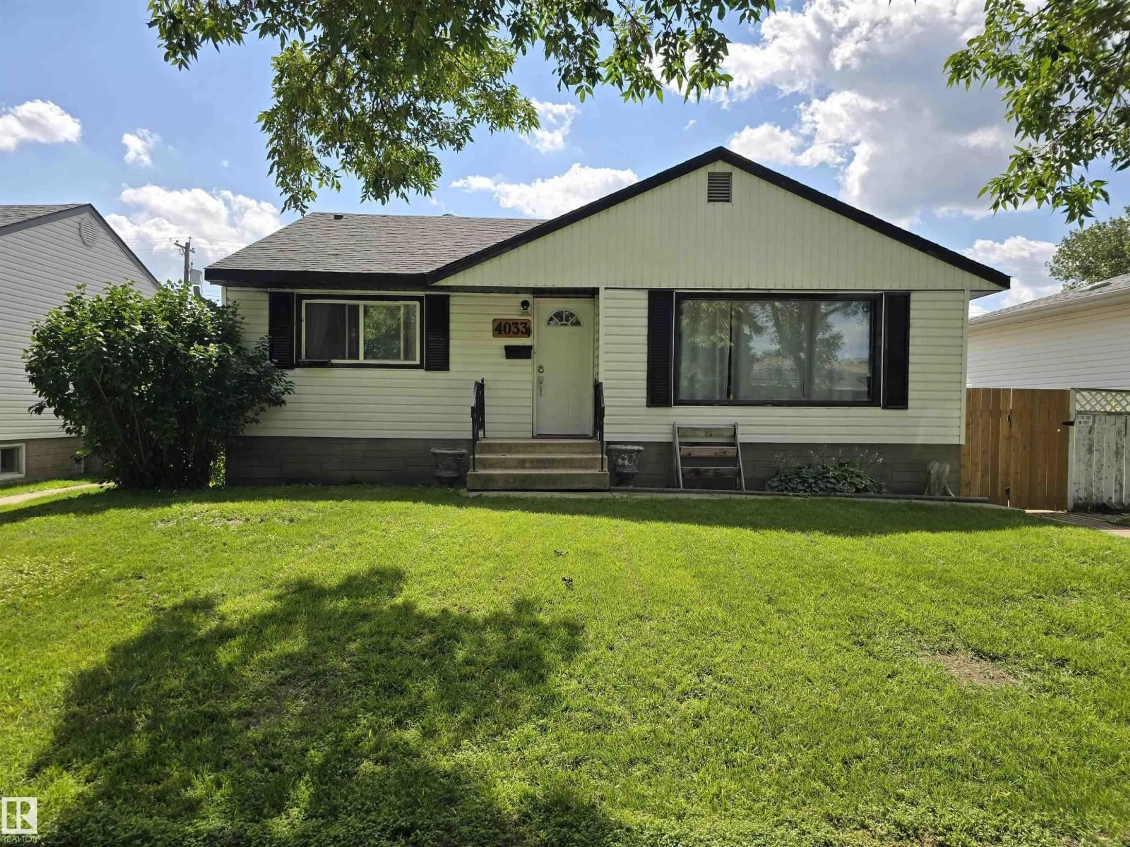 A pic from outside/outdoor area/front of a property/back of a property/a pic from drone, street for 4033 117 AV, Edmonton Alberta T5W0Y1
