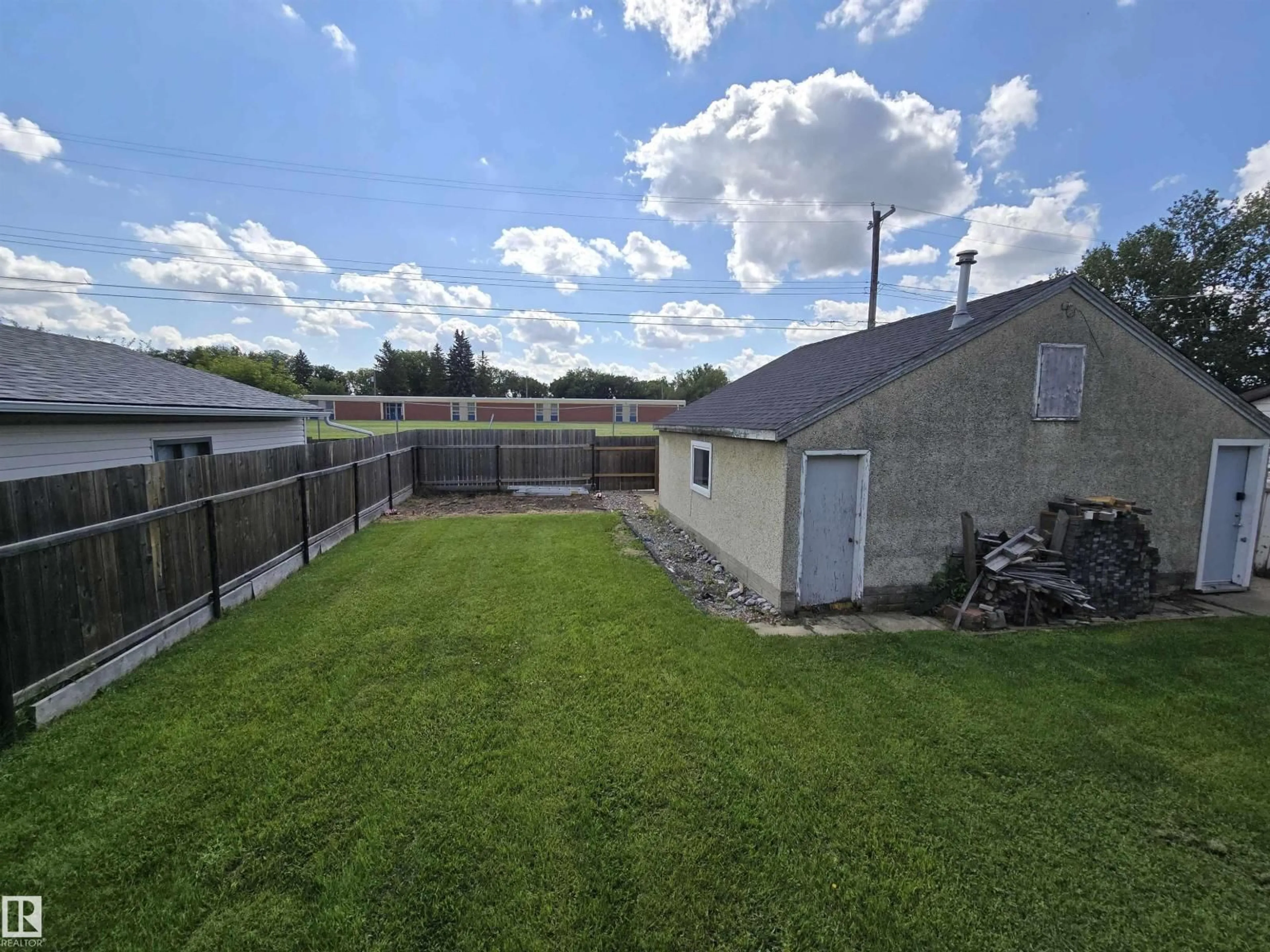 A pic from outside/outdoor area/front of a property/back of a property/a pic from drone, unknown for 4033 117 AV, Edmonton Alberta T5W0Y1