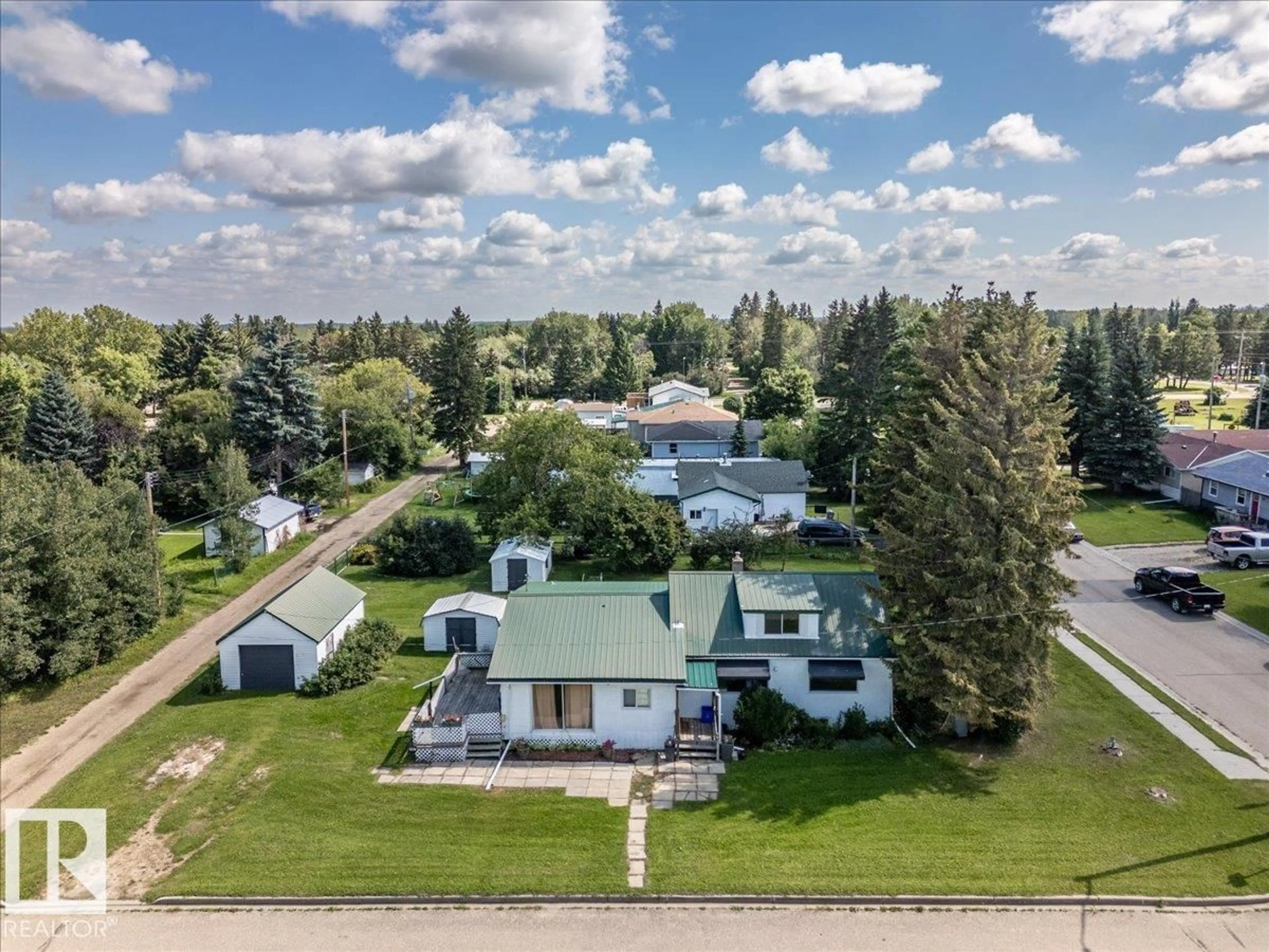 A pic from outside/outdoor area/front of a property/back of a property/a pic from drone, street for 5032 & 5036 53 AVE, Warburg Alberta T0C2T0