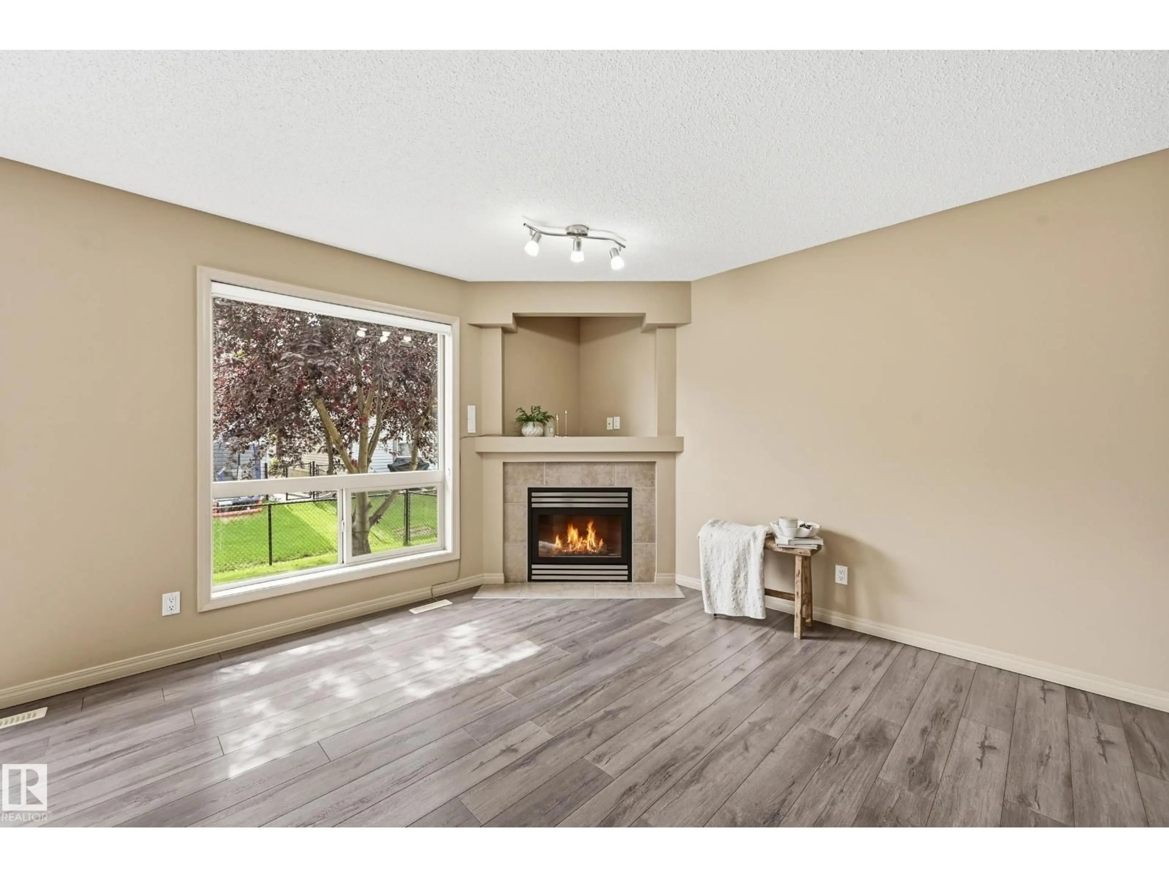 Living room with furniture, wood/laminate floor for #60 - 1128 156 ST, Edmonton Alberta T6R0C9
