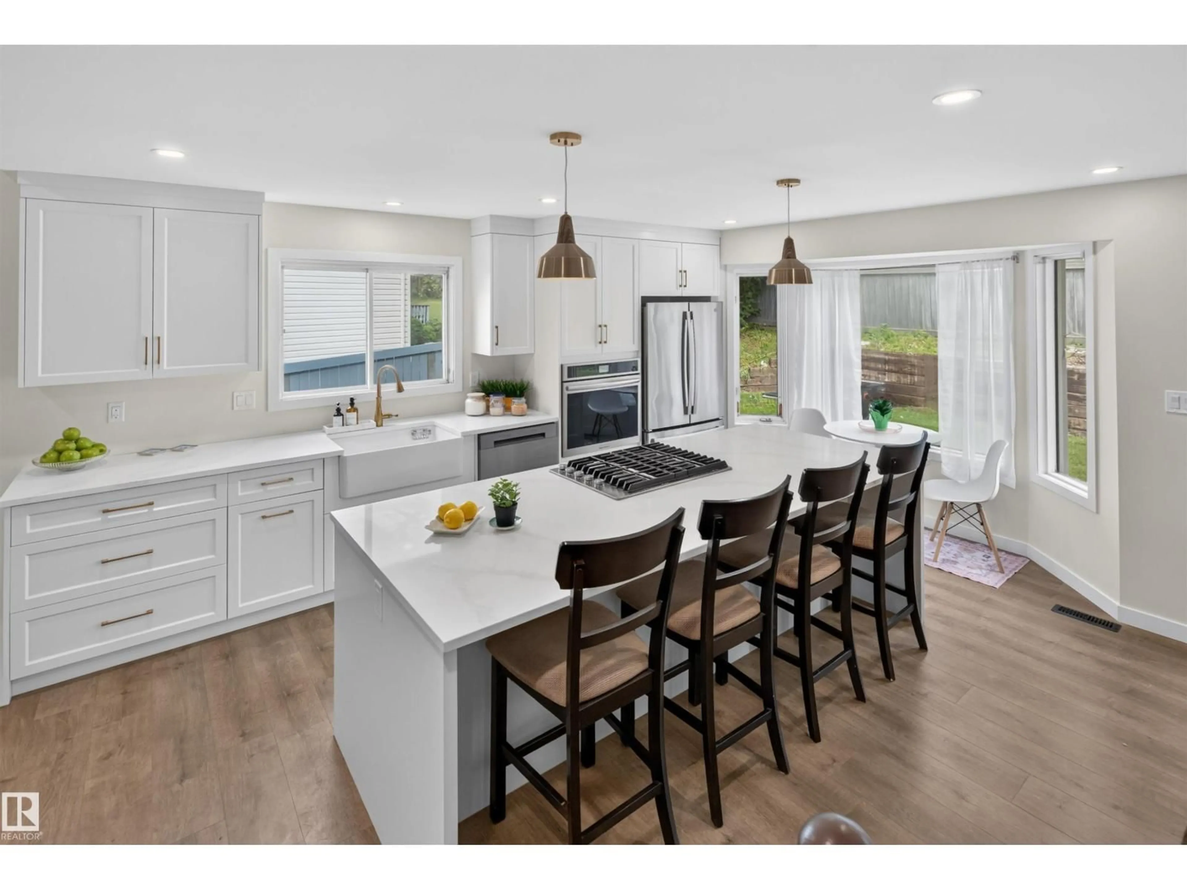 Open concept kitchen, wood/laminate floor for 4216 49 AV, Beaumont Alberta T4X1H2