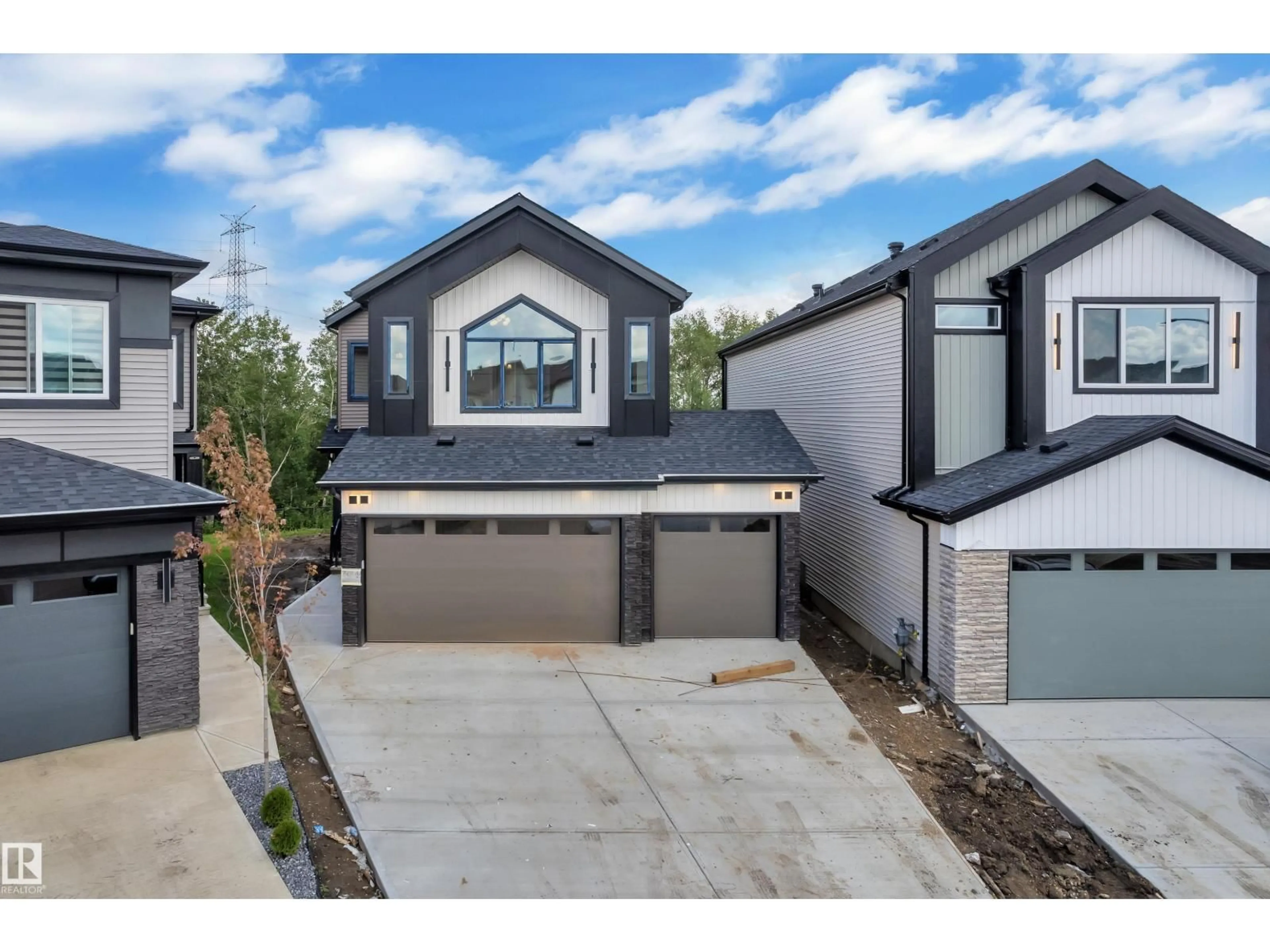 A pic from outside/outdoor area/front of a property/back of a property/a pic from drone, street for 2408 1 AV, Edmonton Alberta T6X3K4
