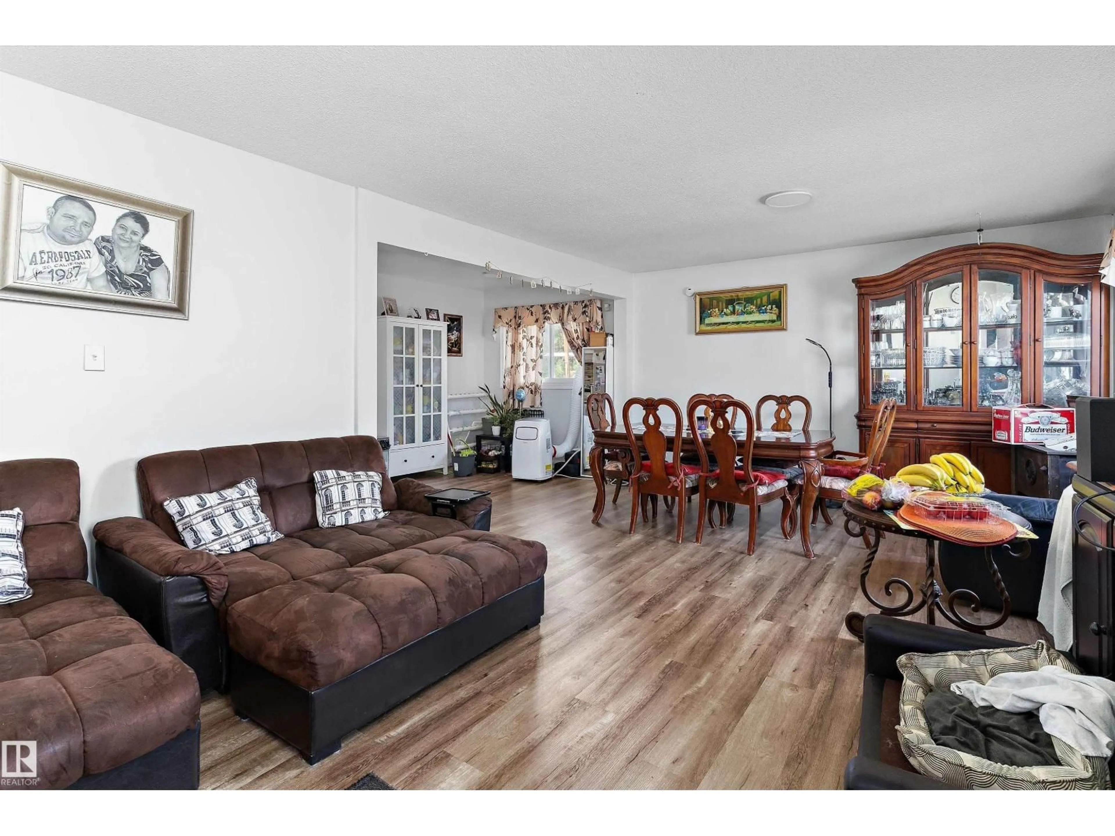 Living room with furniture, wood/laminate floor for 5815 136 AV, Edmonton Alberta T5A0N4