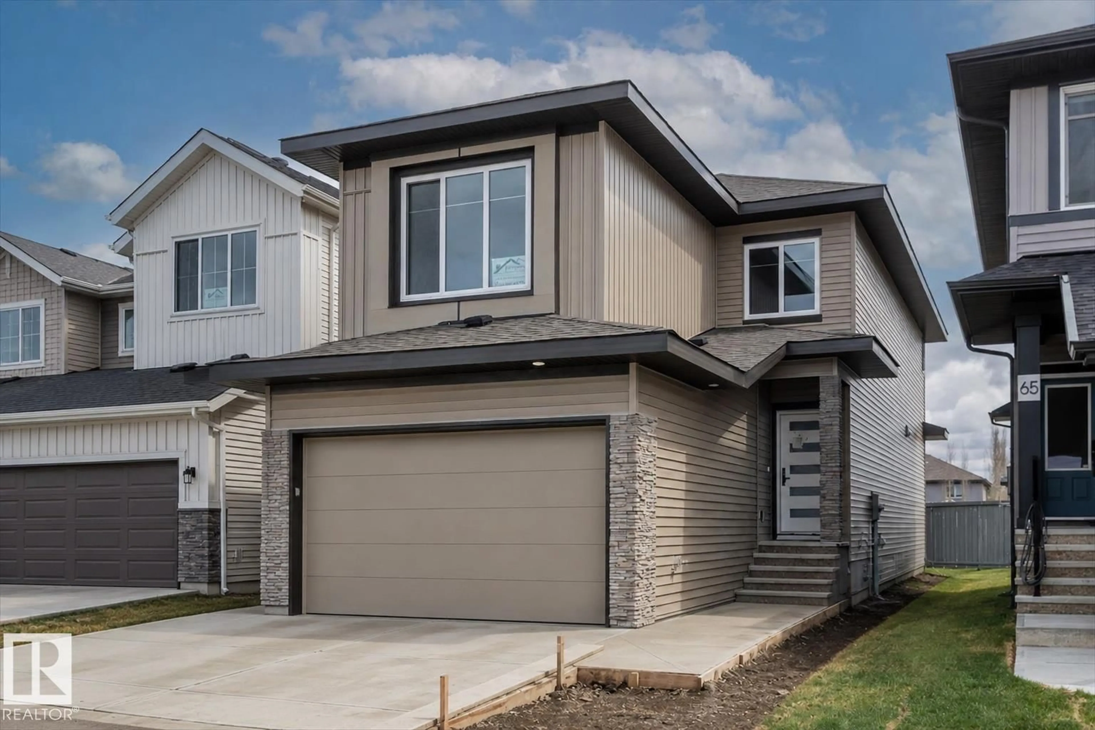 Home with vinyl exterior material, street for 69 ELLIOTT WD, Fort Saskatchewan Alberta T8L1R8