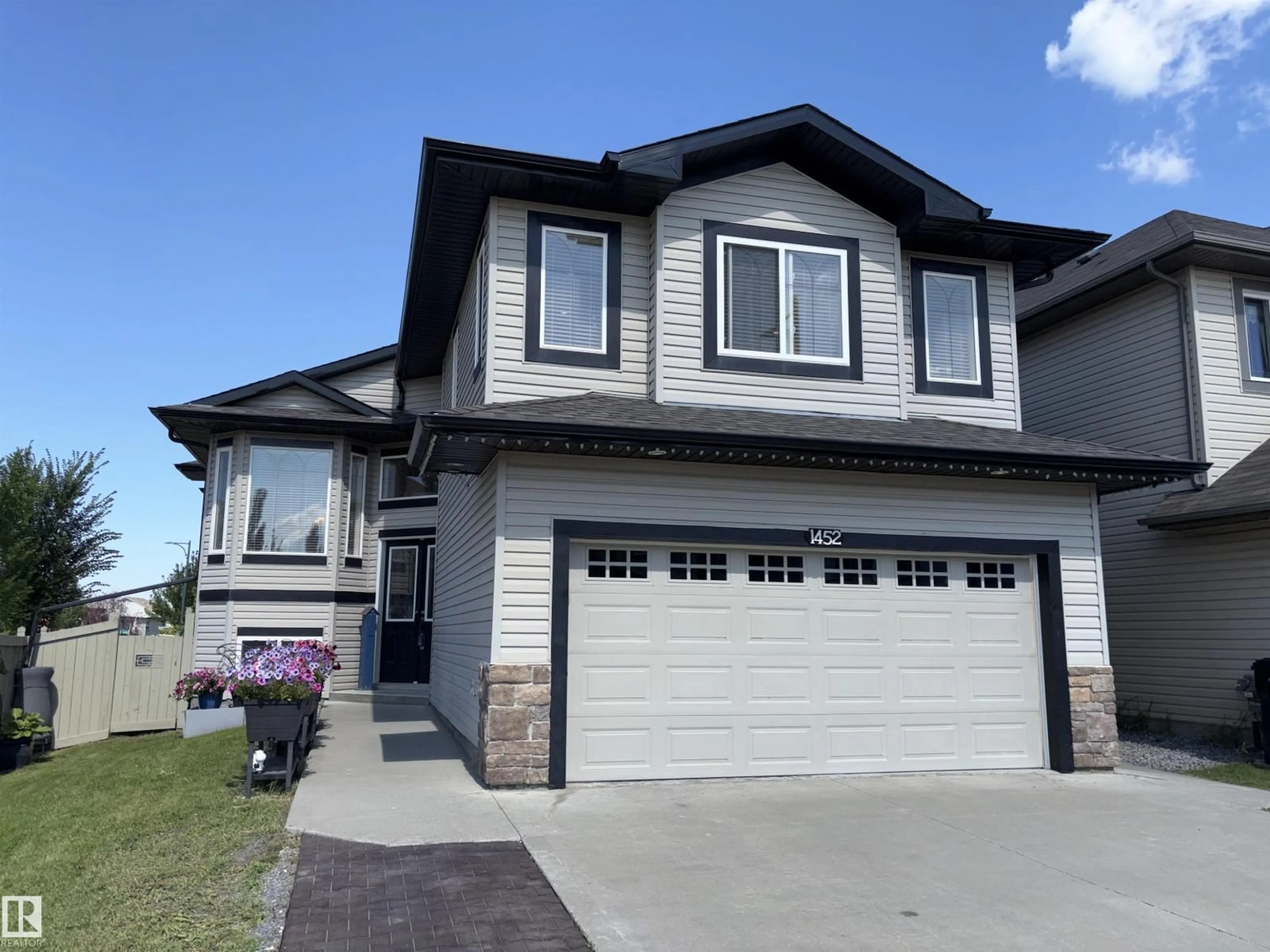 Home with vinyl exterior material, street for 1452 36A AV, Edmonton Alberta T6T0J2