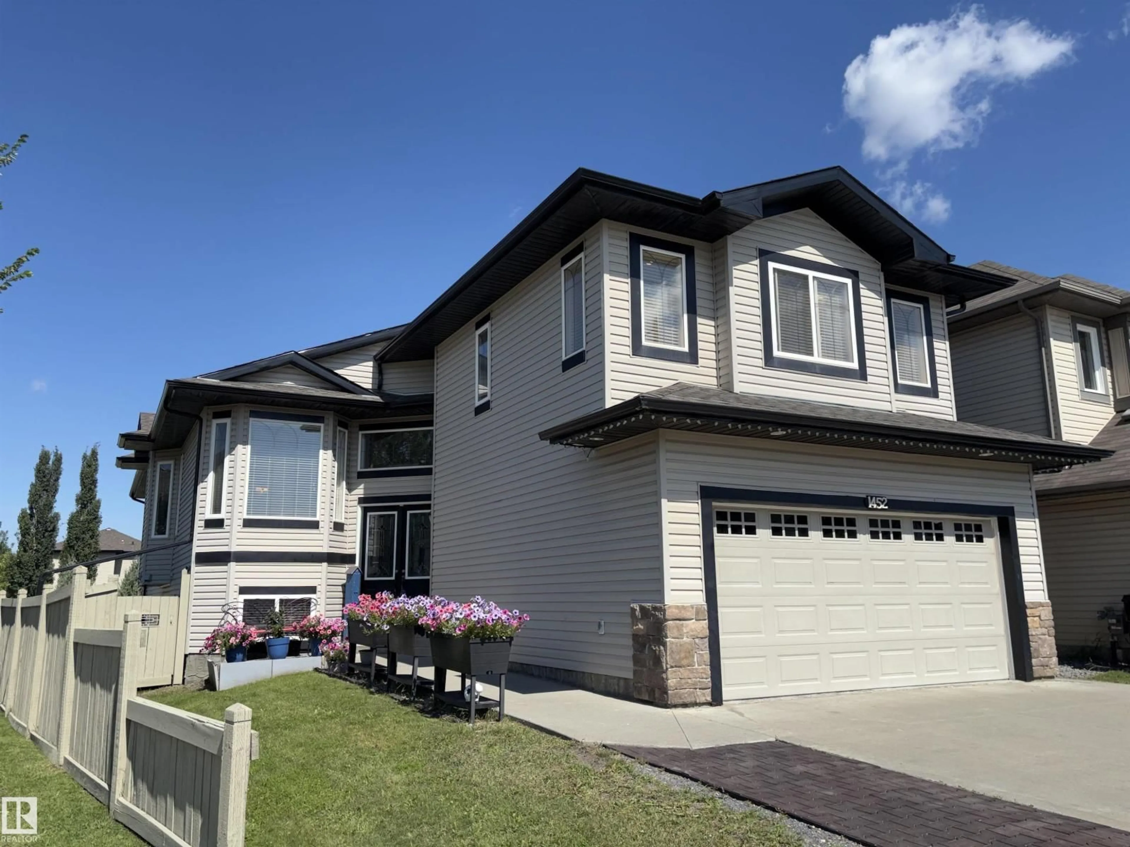 Home with vinyl exterior material, street for 1452 36A AV, Edmonton Alberta T6T0J2