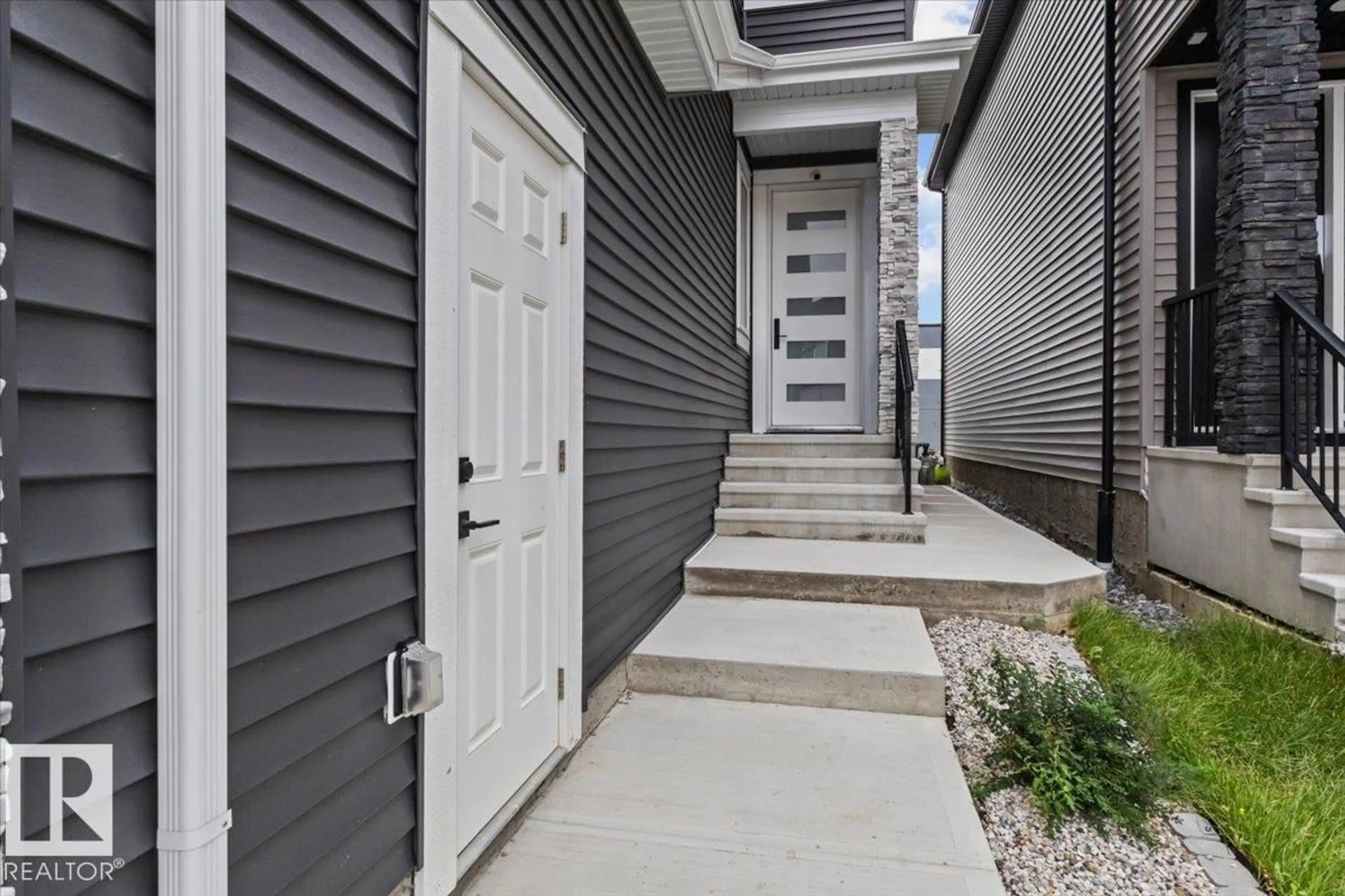 Home with vinyl exterior material, street for 6903 169 AV, Edmonton Alberta T5Z0H2
