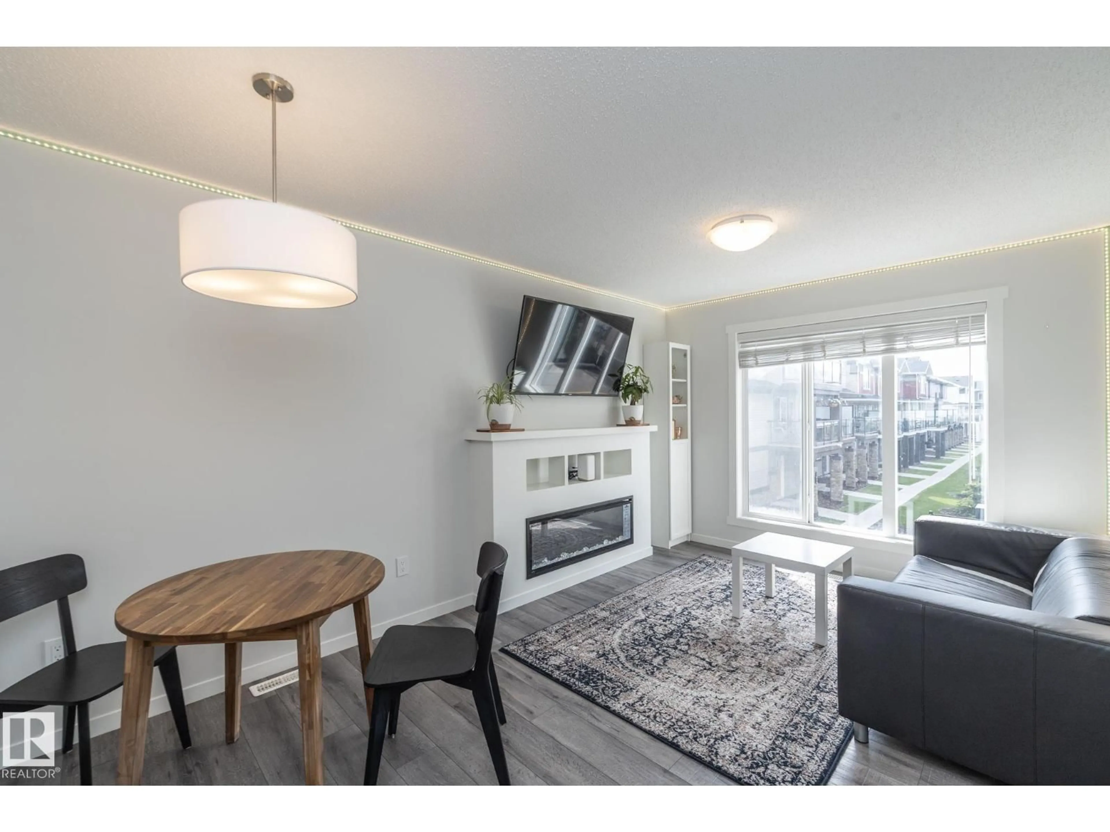 Living room with furniture, wood/laminate floor for #28 - 1530 TAMARACK BV, Edmonton Alberta T6T2E6