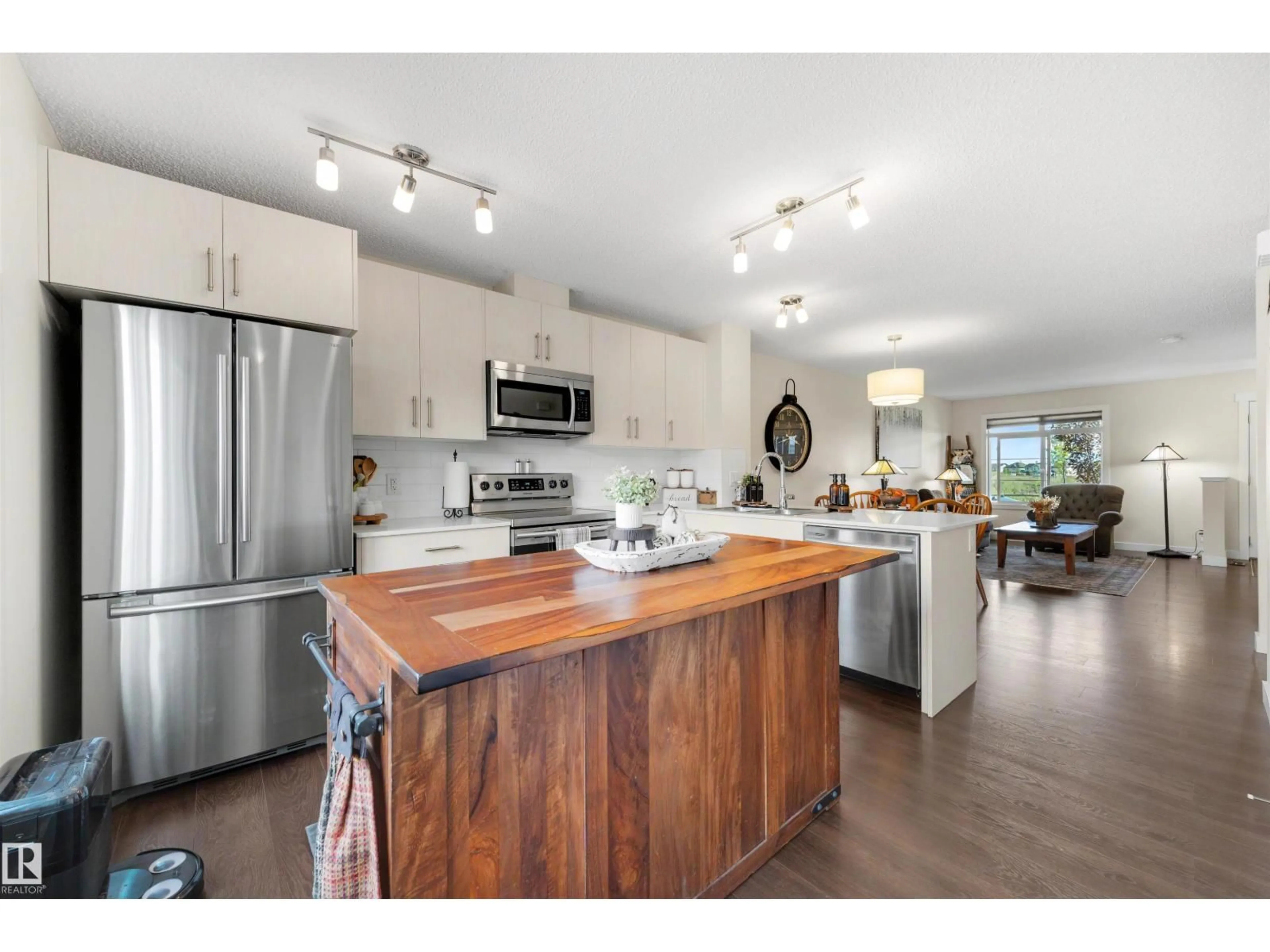Open concept kitchen, wood/laminate floor for 354 CRYSTALLINA NERA DR, Edmonton Alberta T5Z0R9