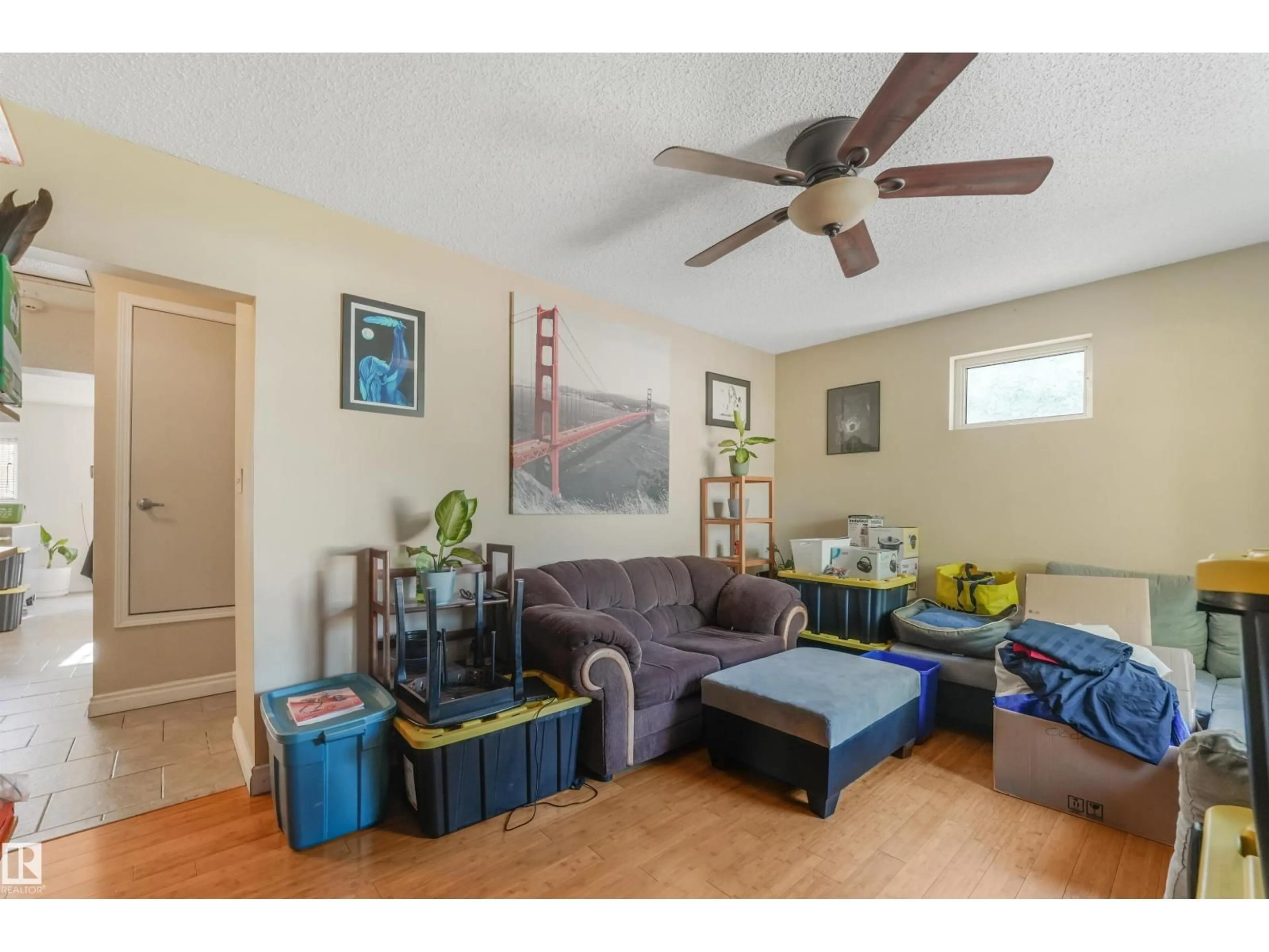 Living room with furniture, wood/laminate floor for NW - 12209 94 ST, Edmonton Alberta T5G1K2