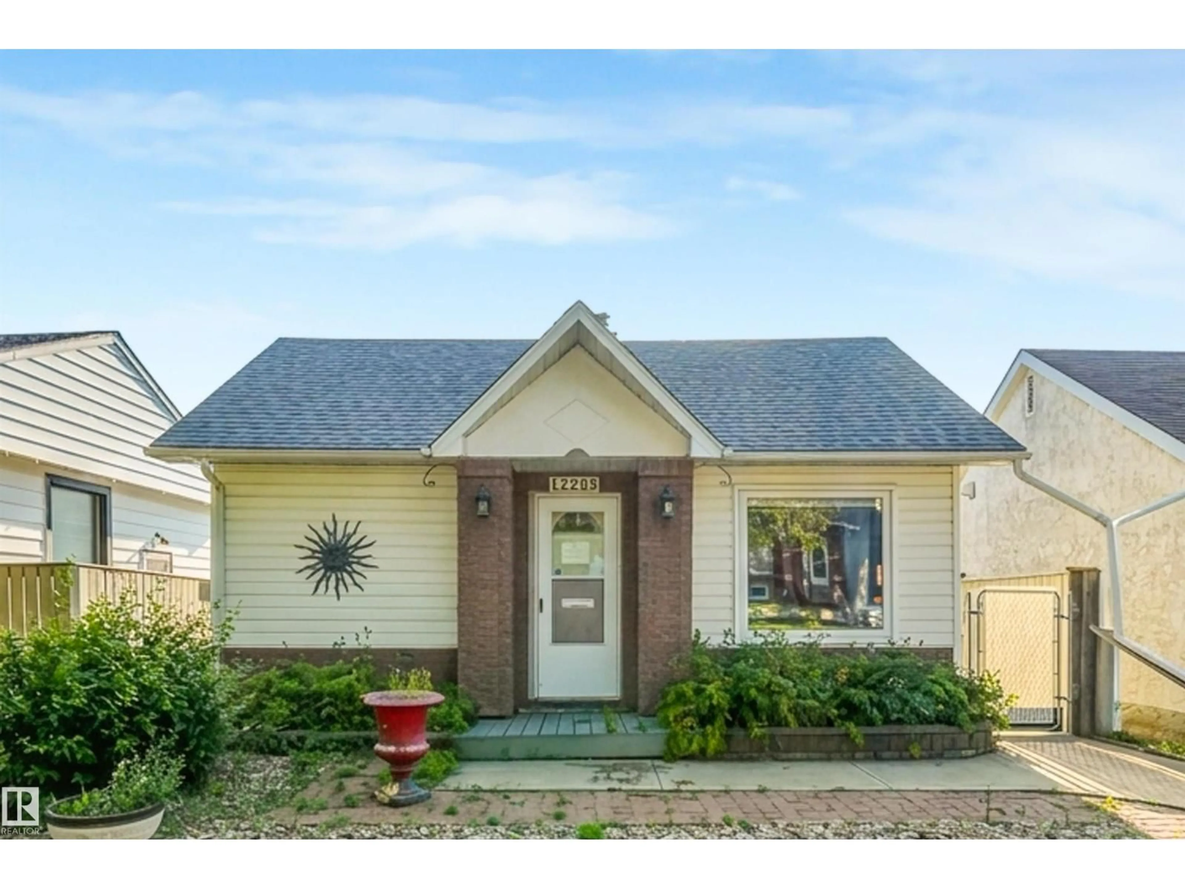 Home with vinyl exterior material, street for NW - 12209 94 ST, Edmonton Alberta T5G1K2