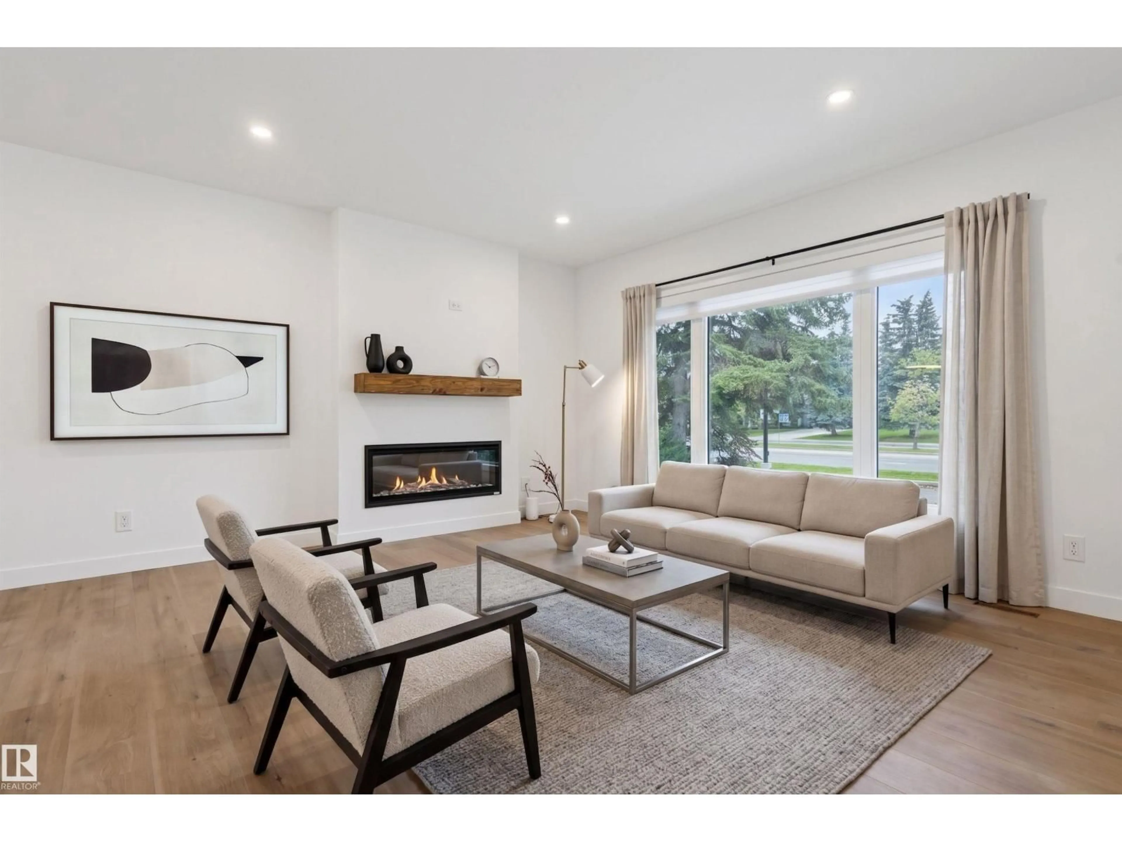 Living room with furniture, wood/laminate floor for NW - 8604 142 ST, Edmonton Alberta T5R0M1