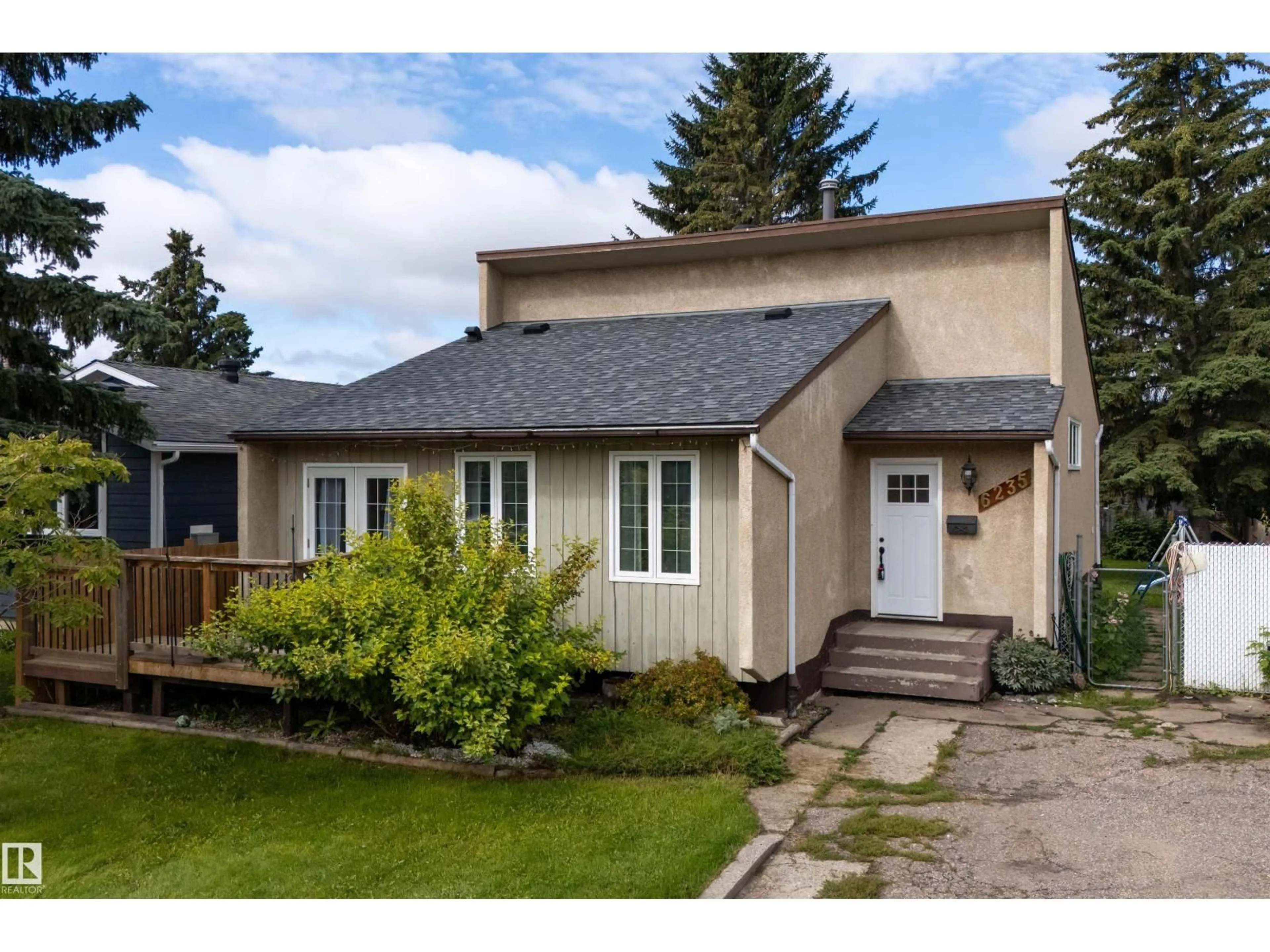 Home with vinyl exterior material, street for 6235 13 AVENUE, Edmonton Alberta T6L2E5