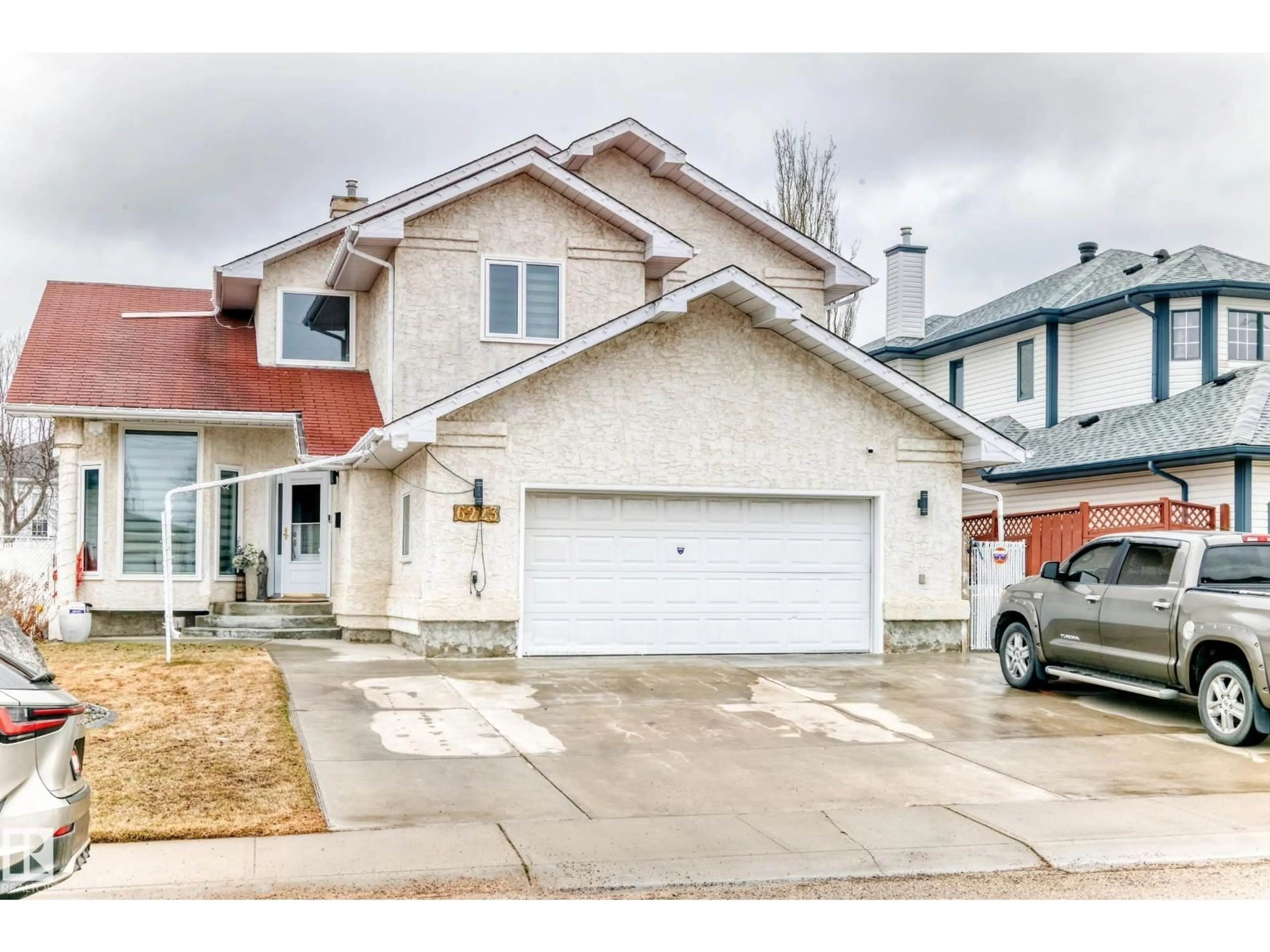 Home with vinyl exterior material, street for NW - 6223 162B AVE, Edmonton Alberta T5Y2S1