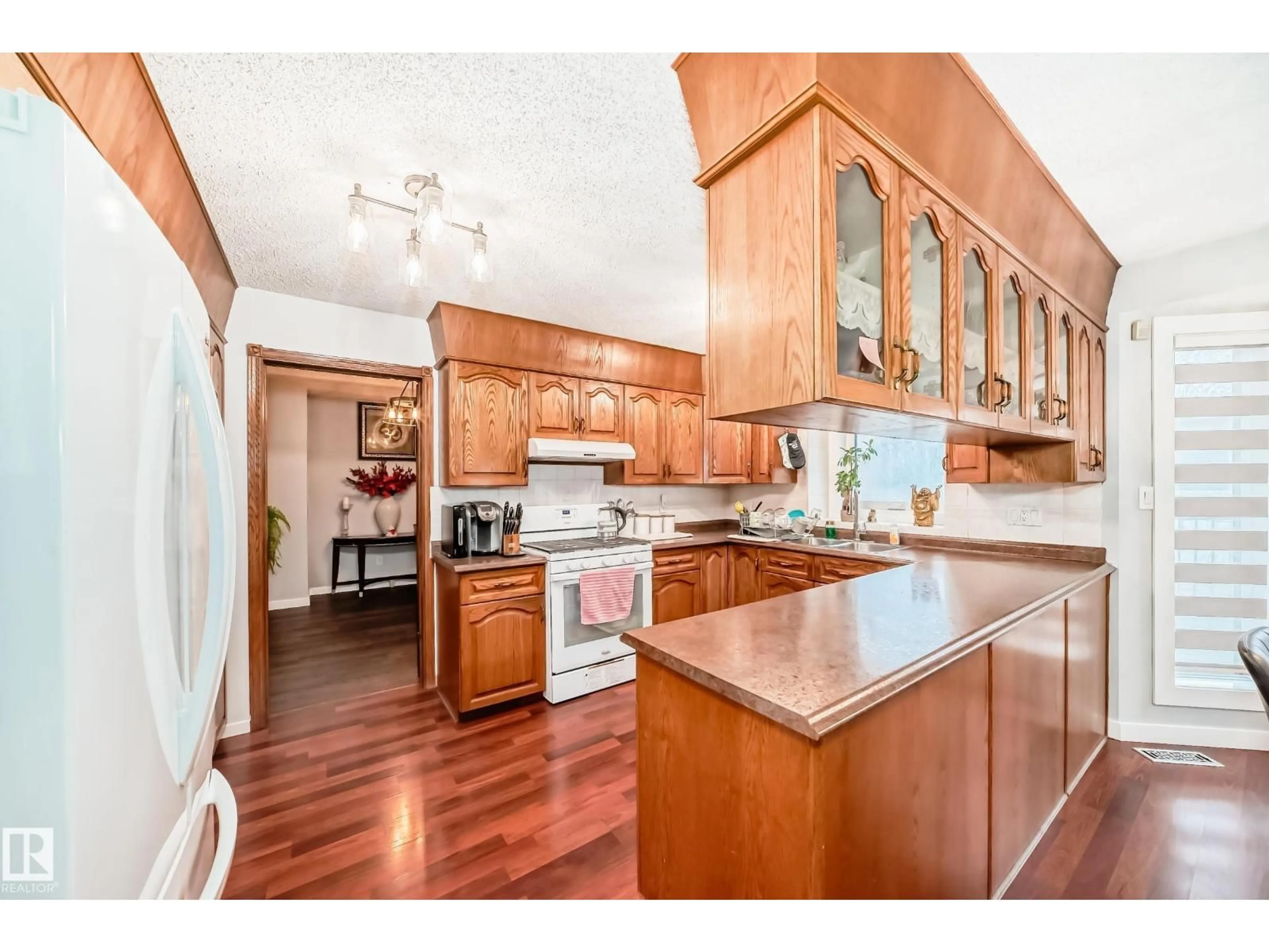 Open concept kitchen, wood/laminate floor for NW - 6223 162B AVE, Edmonton Alberta T5Y2S1