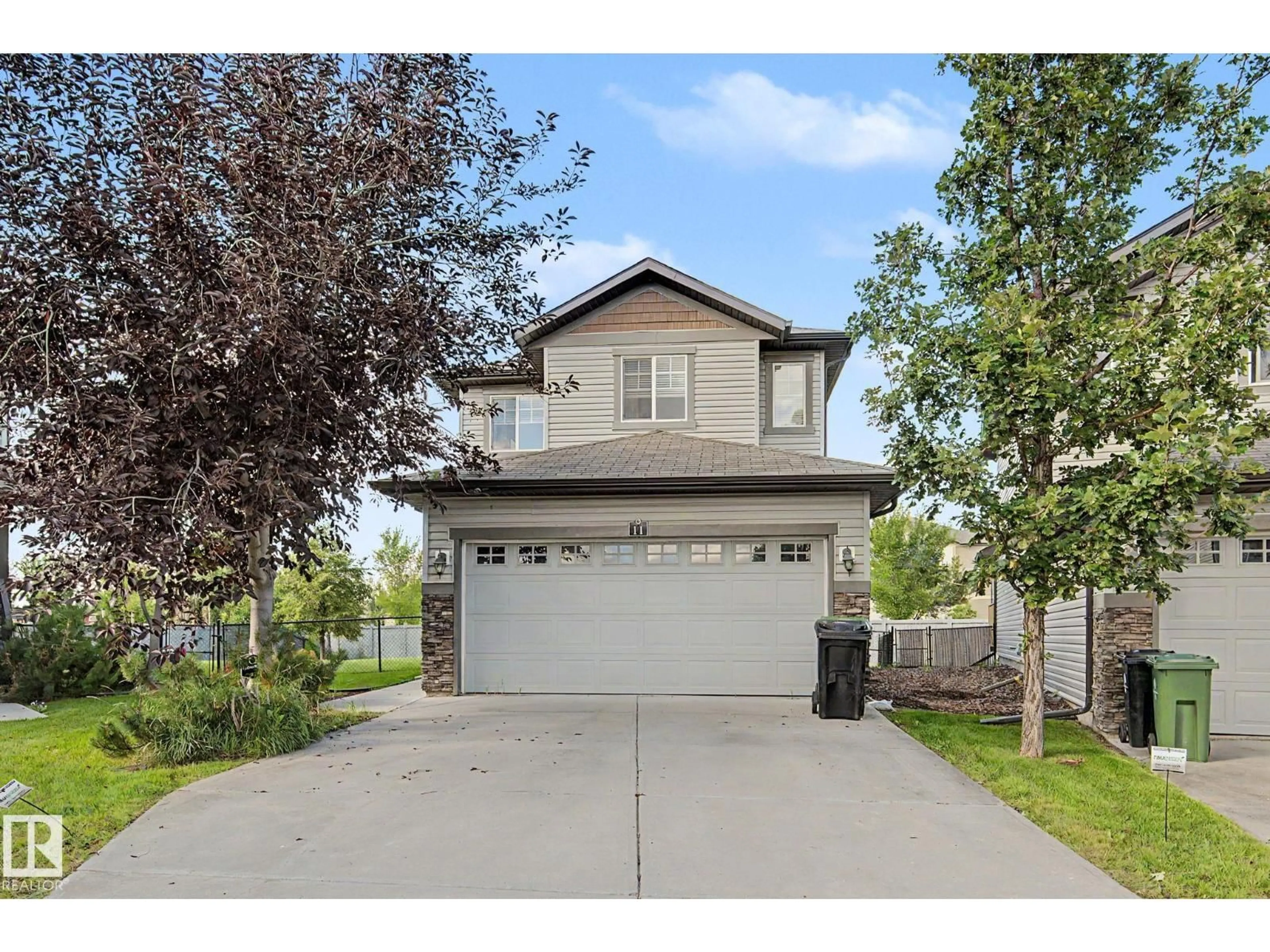 Home with vinyl exterior material, street for 8602 - 11 SOUTHFORT BV, Fort Saskatchewan Alberta T8L0J8