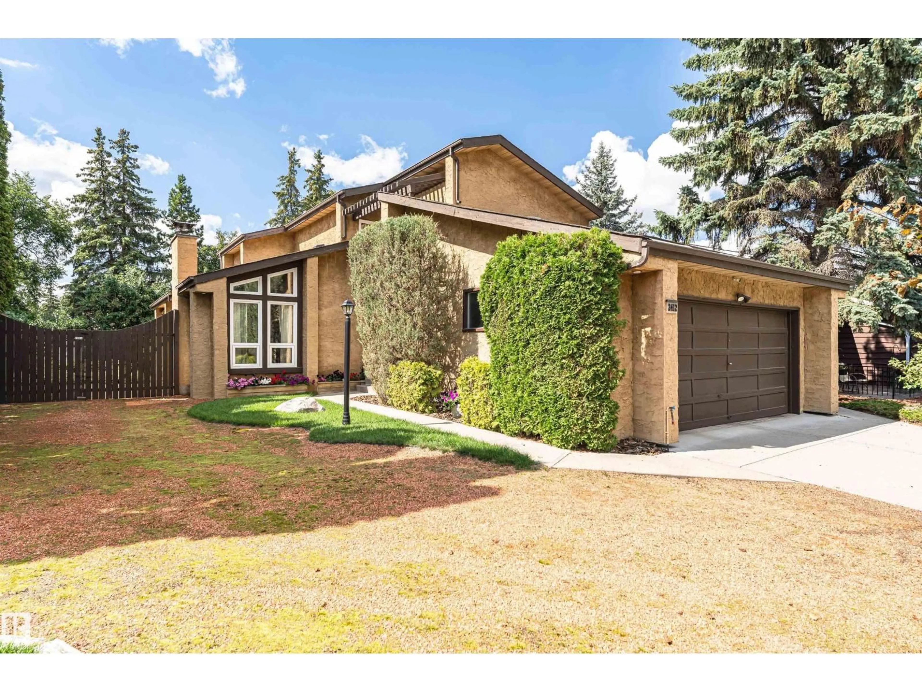 Home with brick exterior material, street for 2412 115 ST, Edmonton Alberta T6J3S1