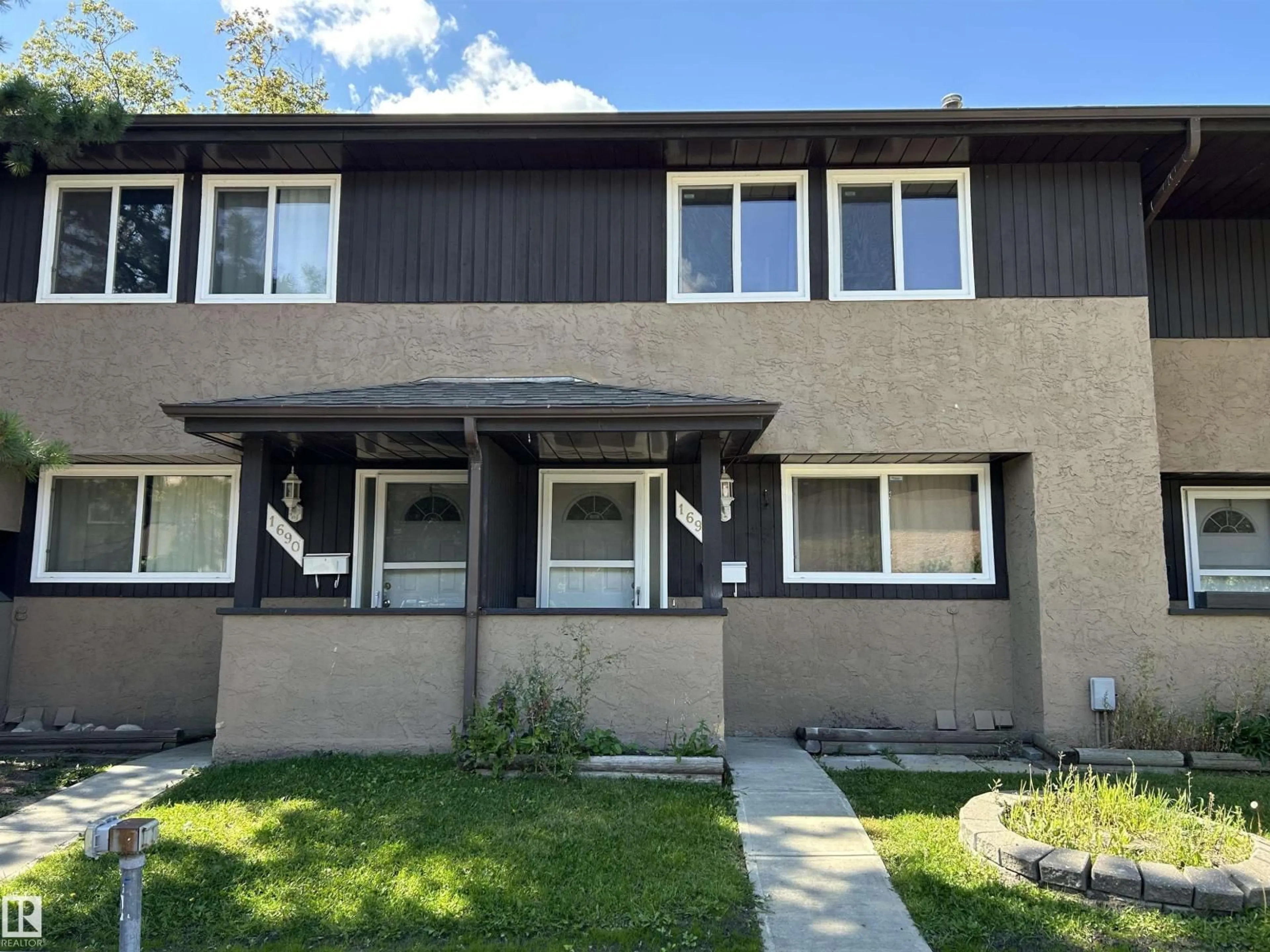 Home with vinyl exterior material, street for 1692 37 ST, Edmonton Alberta T6L2R7