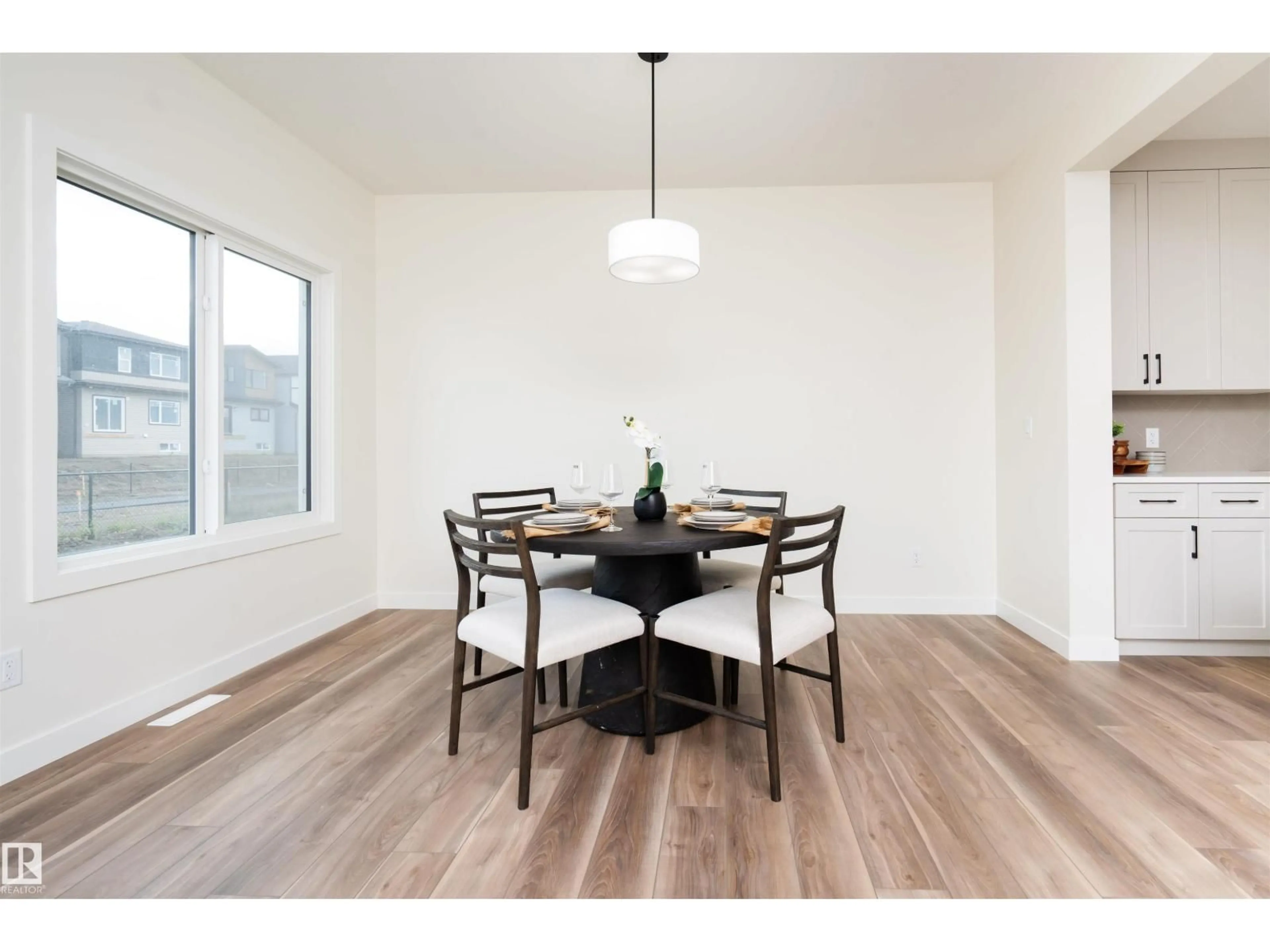 Dining room, wood/laminate floor for 2623 5 AV, Edmonton Alberta T6X3J1