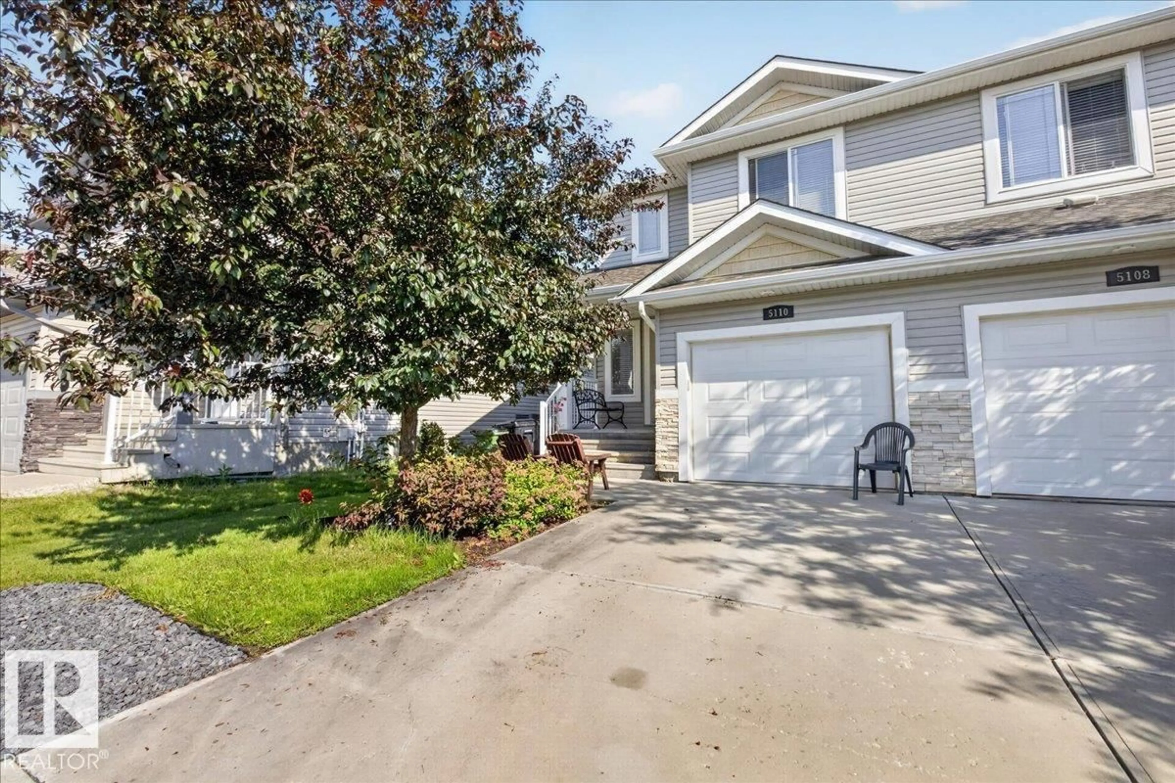 Home with vinyl exterior material, street for NW - 5110 168A AV, Edmonton Alberta T5Y0R9