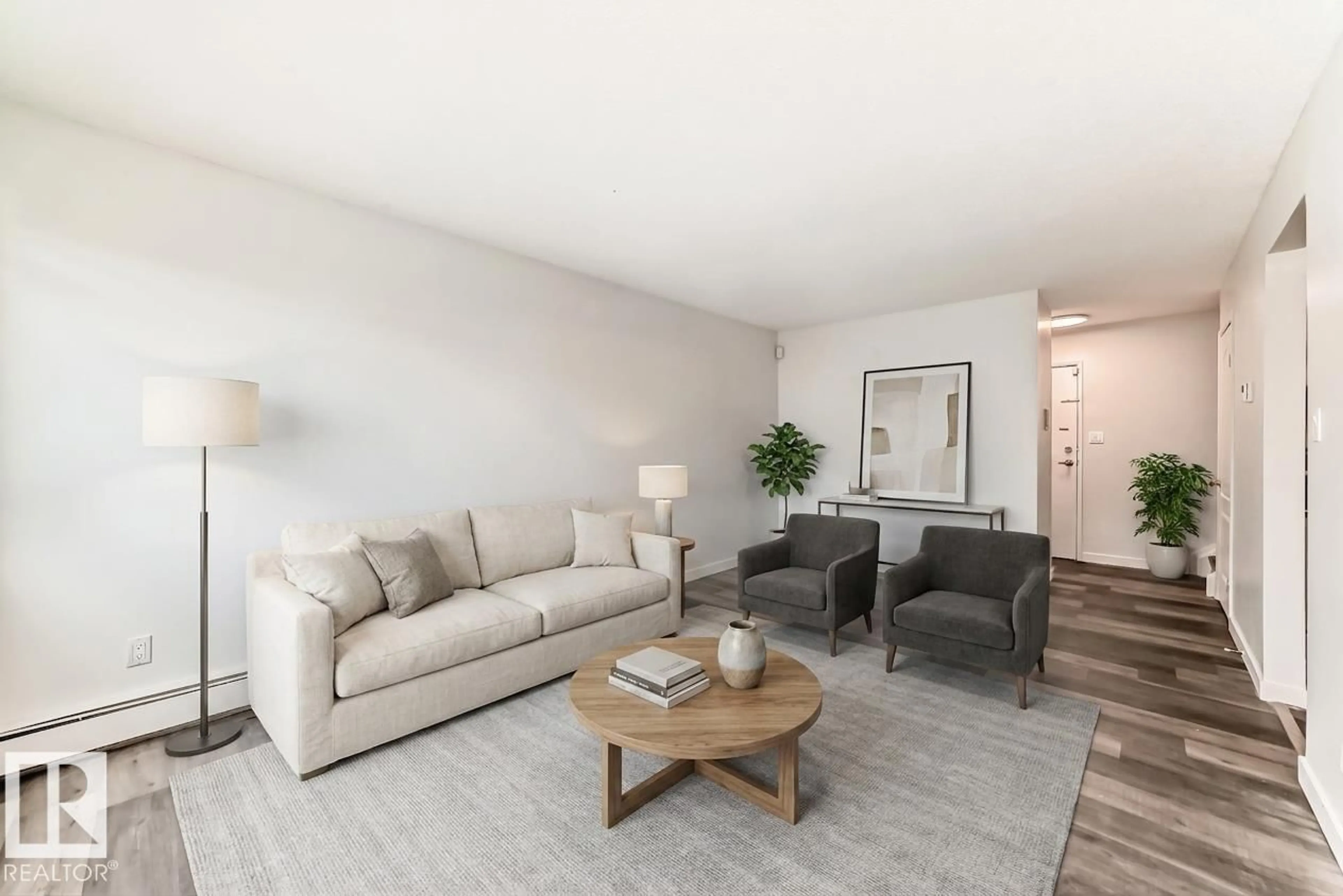 Living room with furniture, wood/laminate floor for 18B - 18305 89 AV, Edmonton Alberta T5T1X2