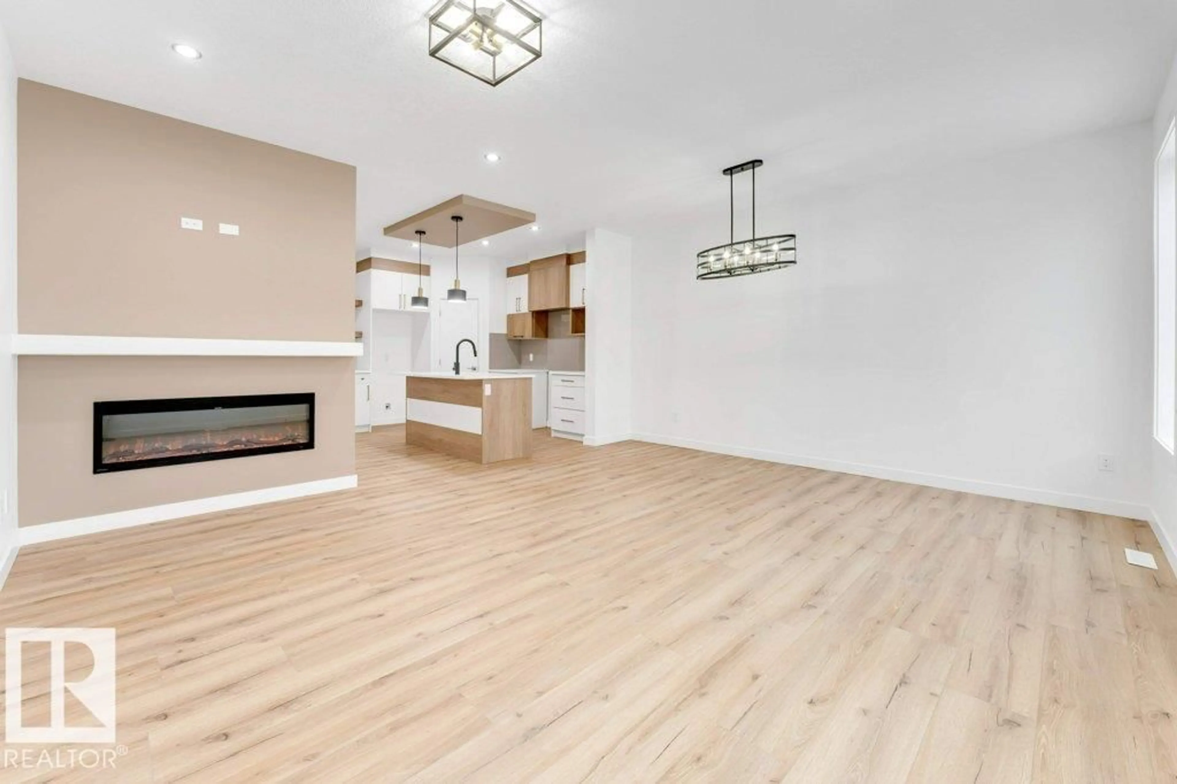 Open concept kitchen, wood/laminate floor for 182 PACIFIC DRIVE, Spruce Grove Alberta T7X4T1