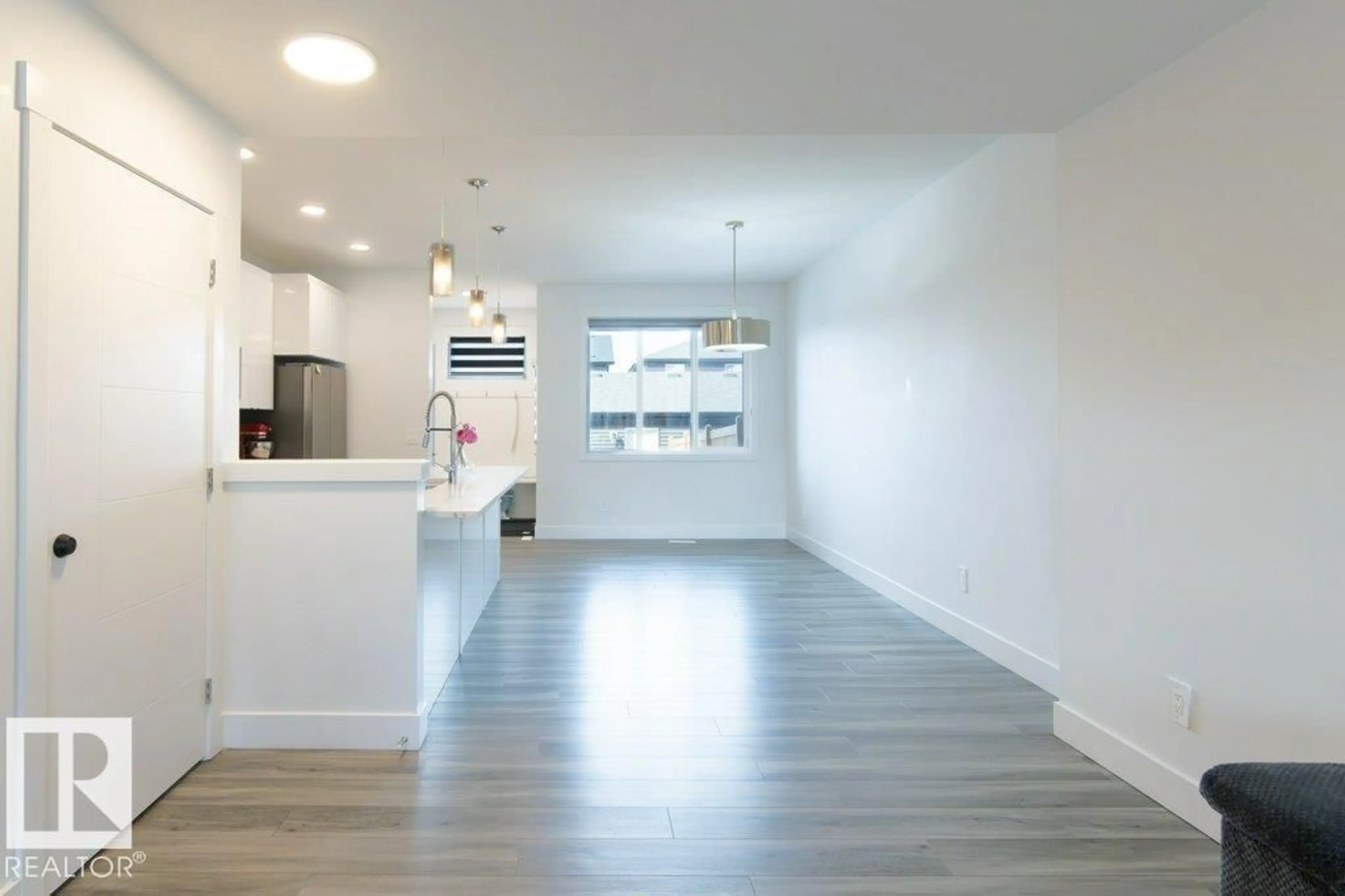 Open concept kitchen, wood/laminate floor for 1434 KESWICK DR, Edmonton Alberta T6W4T9