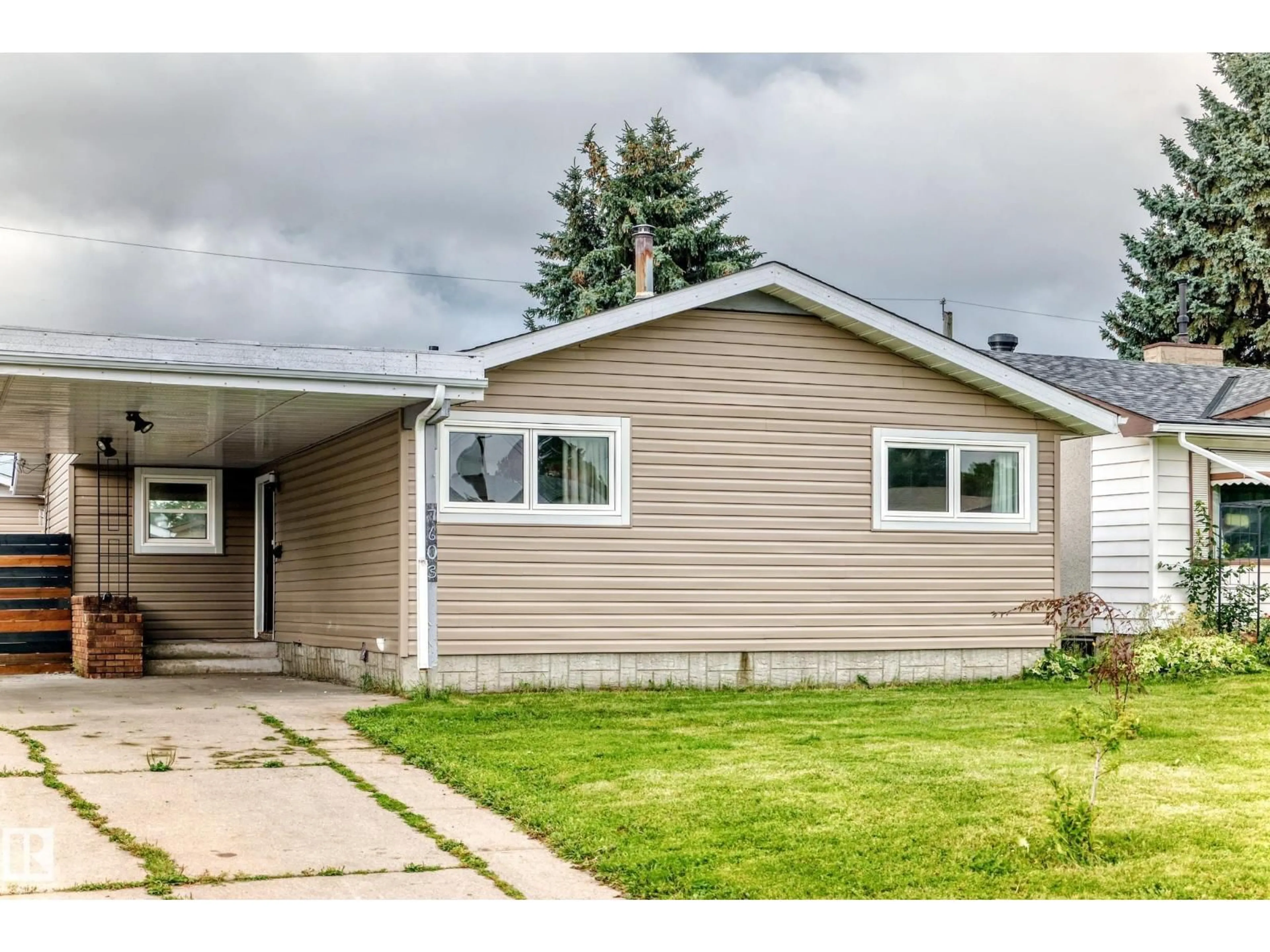 Home with vinyl exterior material, street for 7603 130 AV, Edmonton Alberta T5C1Y3