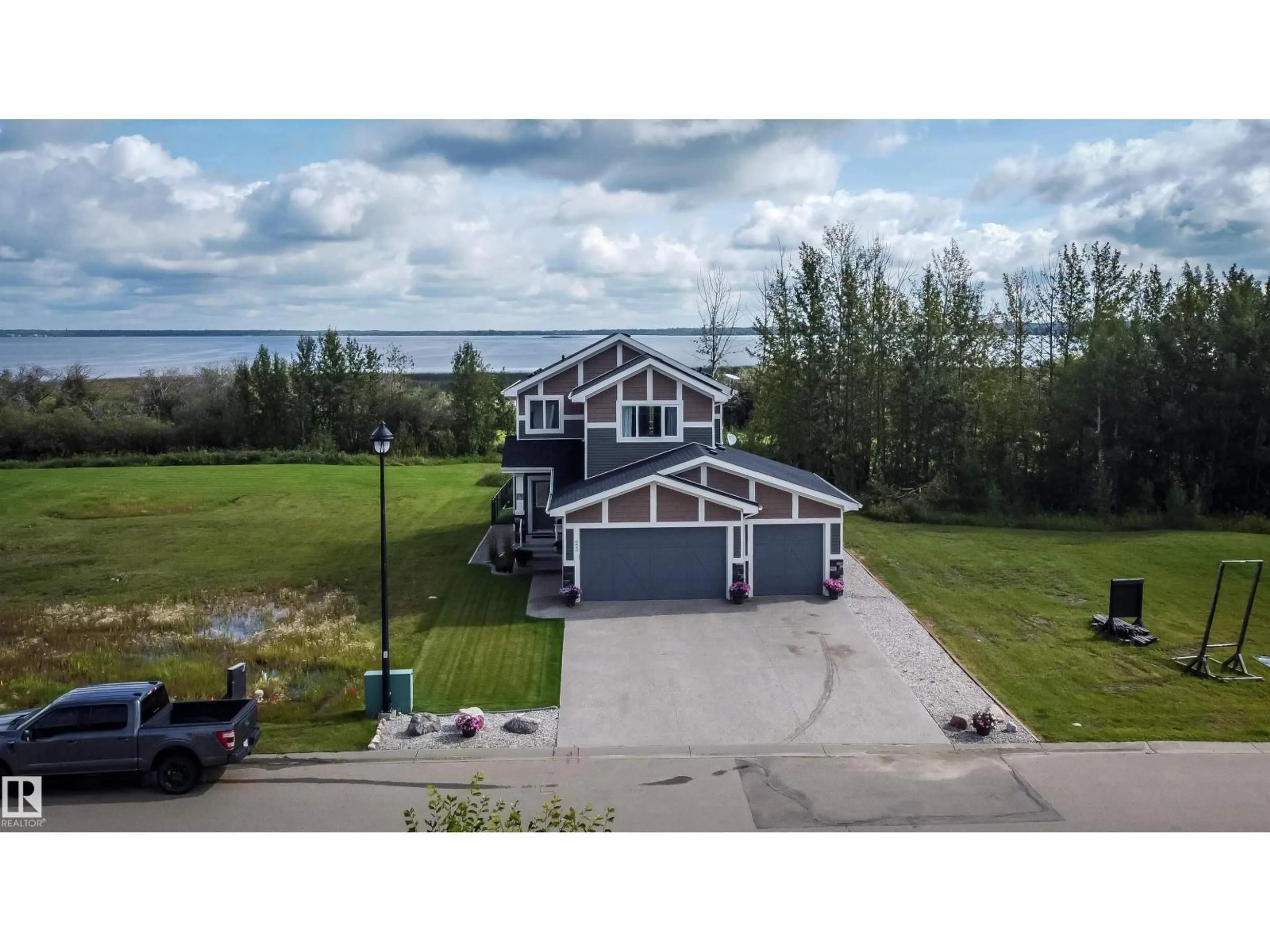 A pic from outside/outdoor area/front of a property/back of a property/a pic from drone, unknown for 3410 STE. ANNE TR, Rural Lac Ste. Anne County Alberta T0E0A1