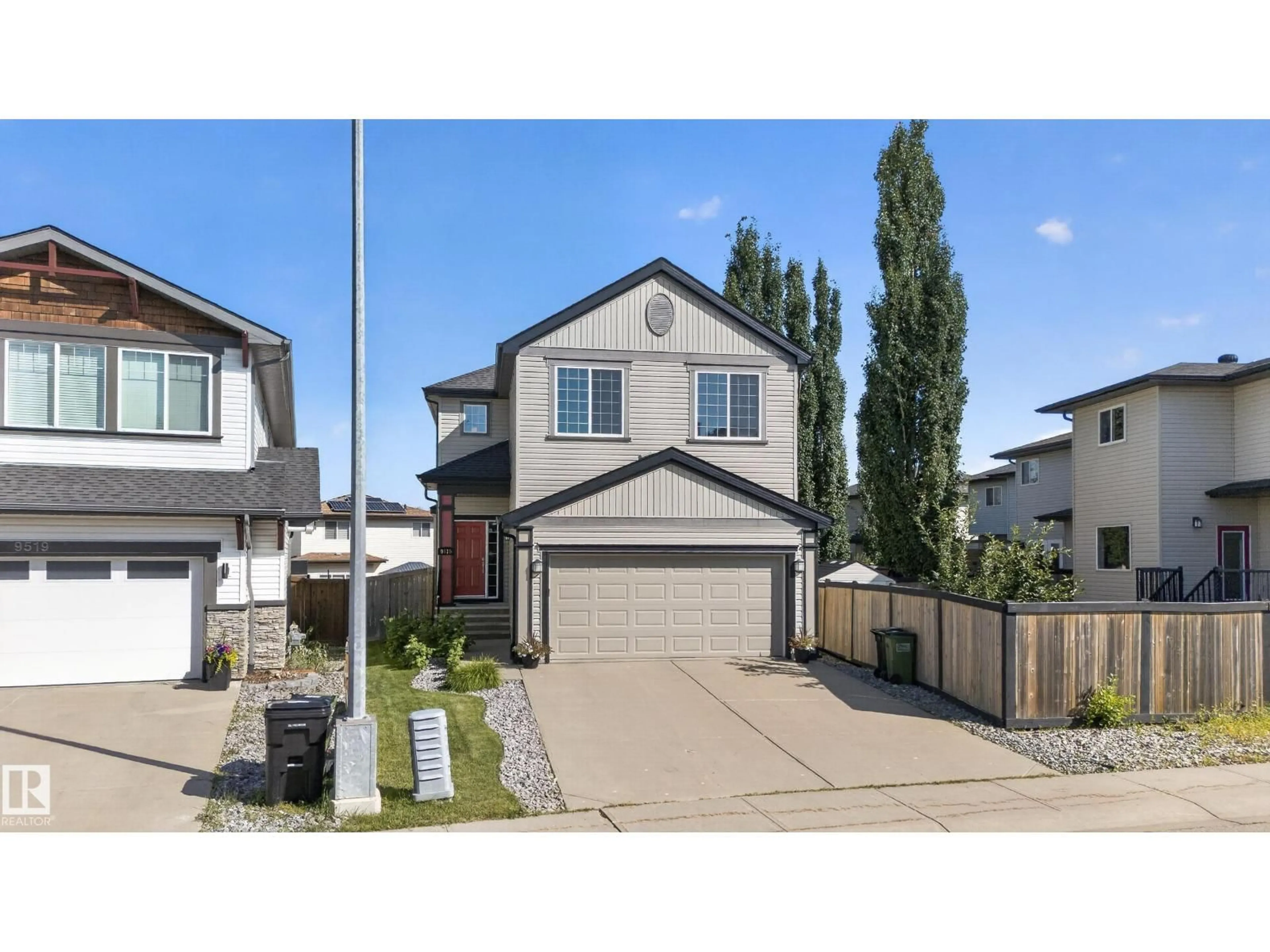 Home with vinyl exterior material, street for NW - 9515 221 ST, Edmonton Alberta T5T4A8