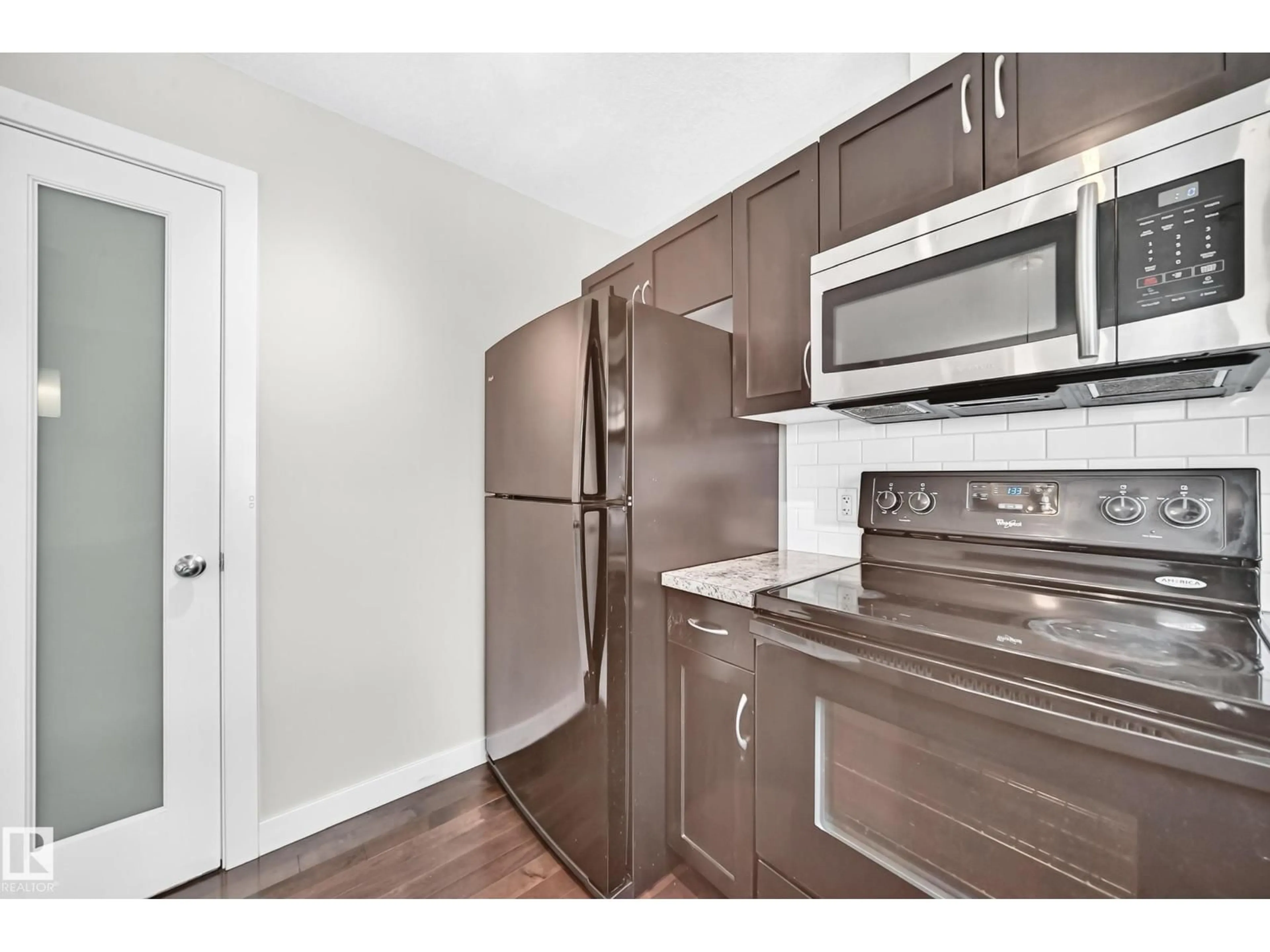 Standard kitchen, wood/laminate floor for 73 9535 217 ST NW, Edmonton Alberta T5T4P5